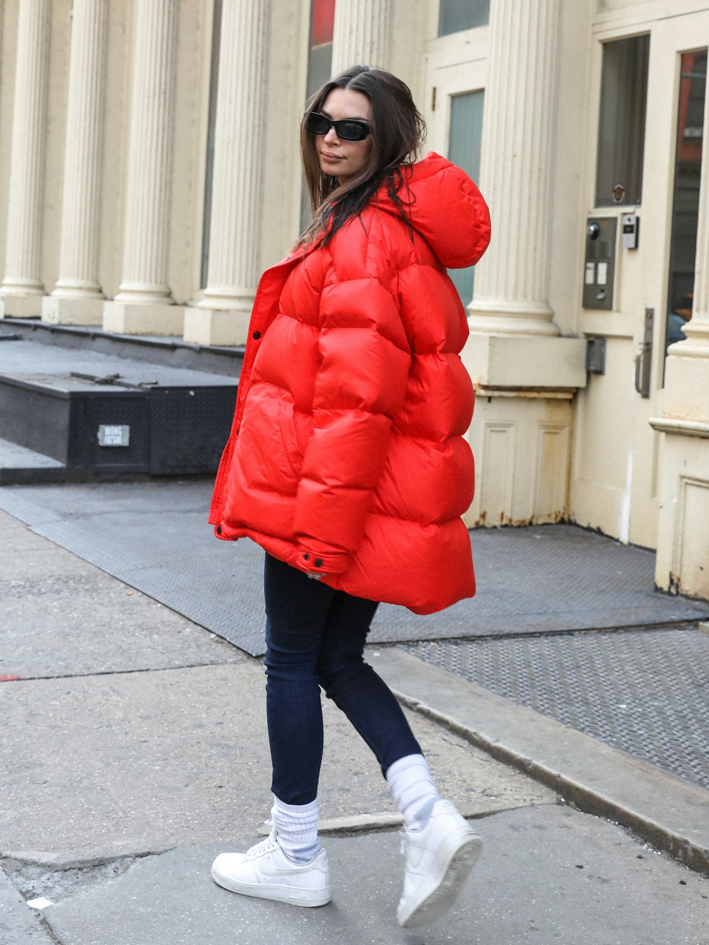 Emily Ratajkowski in a red puffer coat