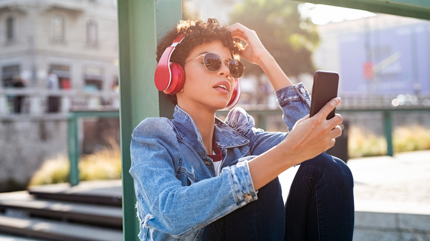 Woman listening to music on iPhone