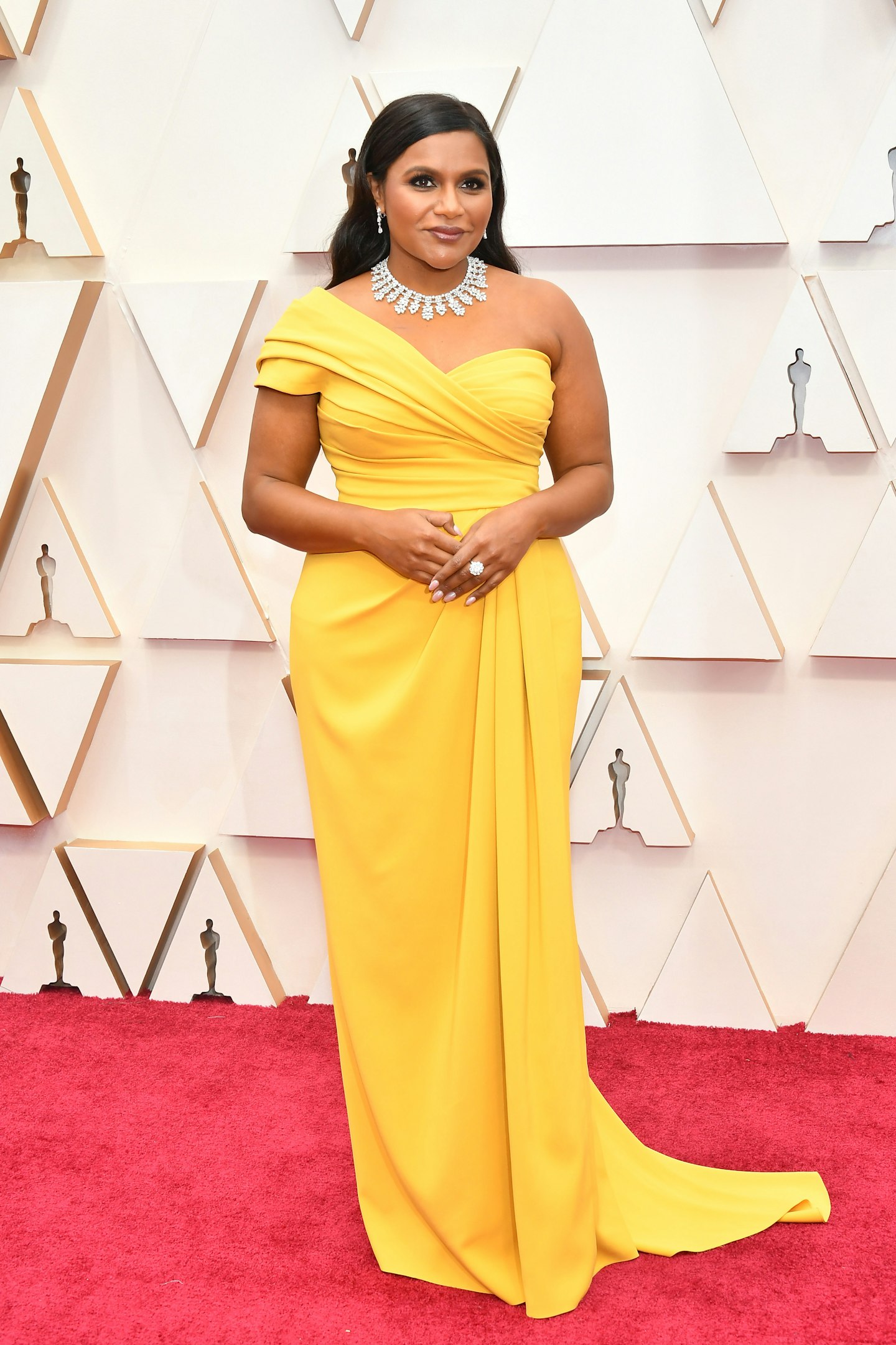 Mindy Kaling wore a one shoulder, canary yellow gown