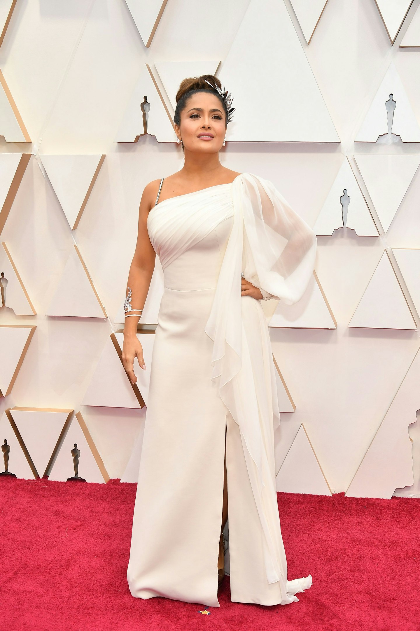 Salma Hayek Pinault wore a white Gucci gown