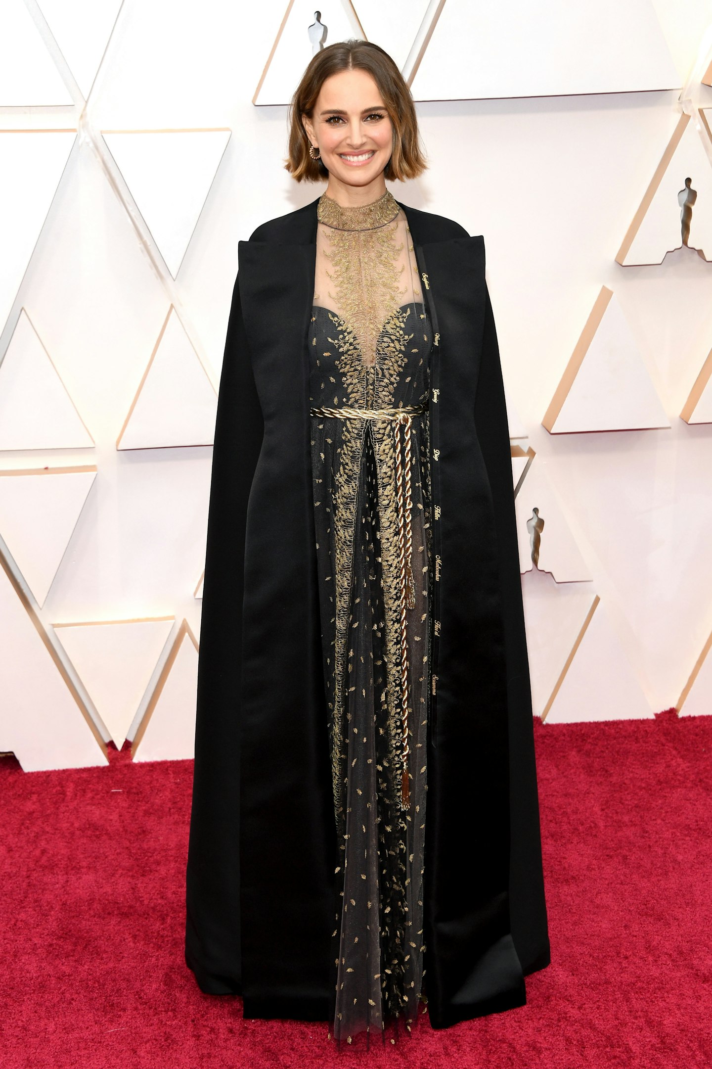 Natalie Portman wore a Dior look with a cape embroidered with the names of all the women who were snubbed by the Academy this year