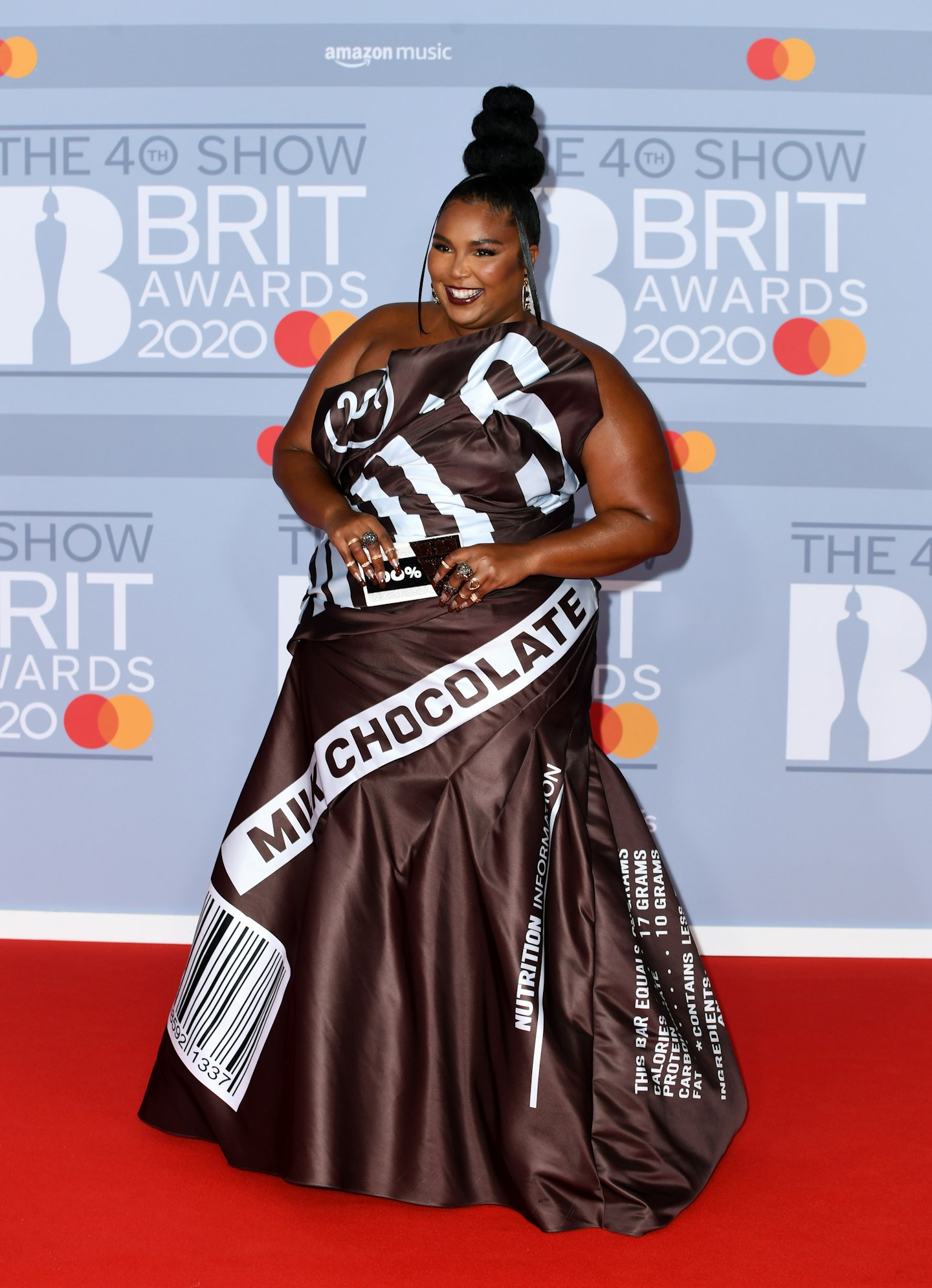 Lizzo in a Moschino gown designed to resemble a Hershey's chocolate bar wrapper