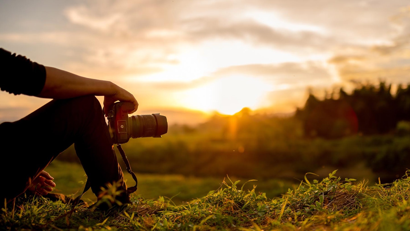 Photographer taking photo with Fujifilm lens