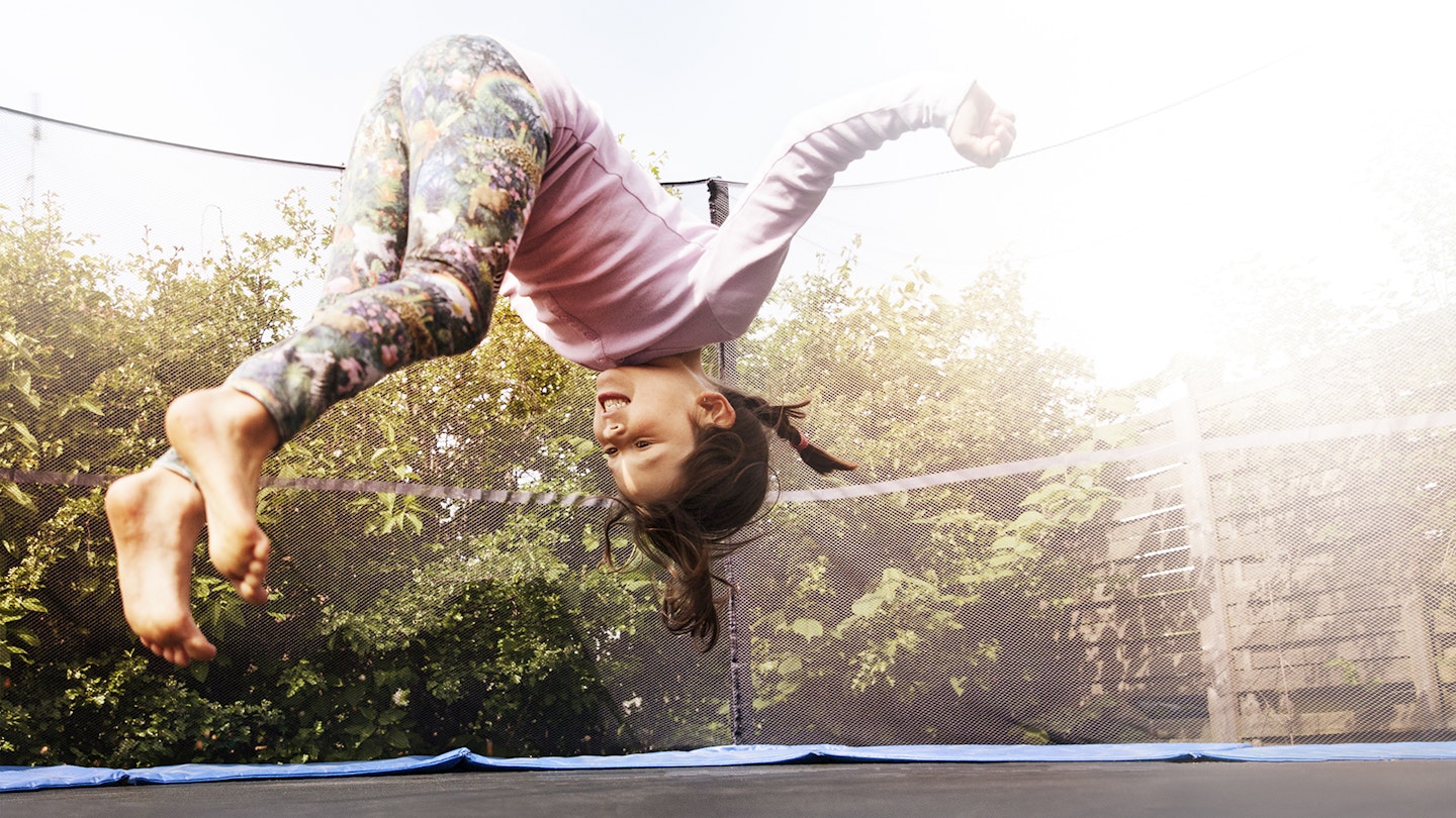 Girl bouncing on a trampoline 