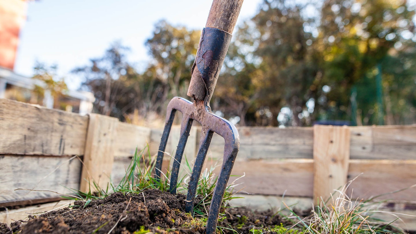 Garden fork in soil