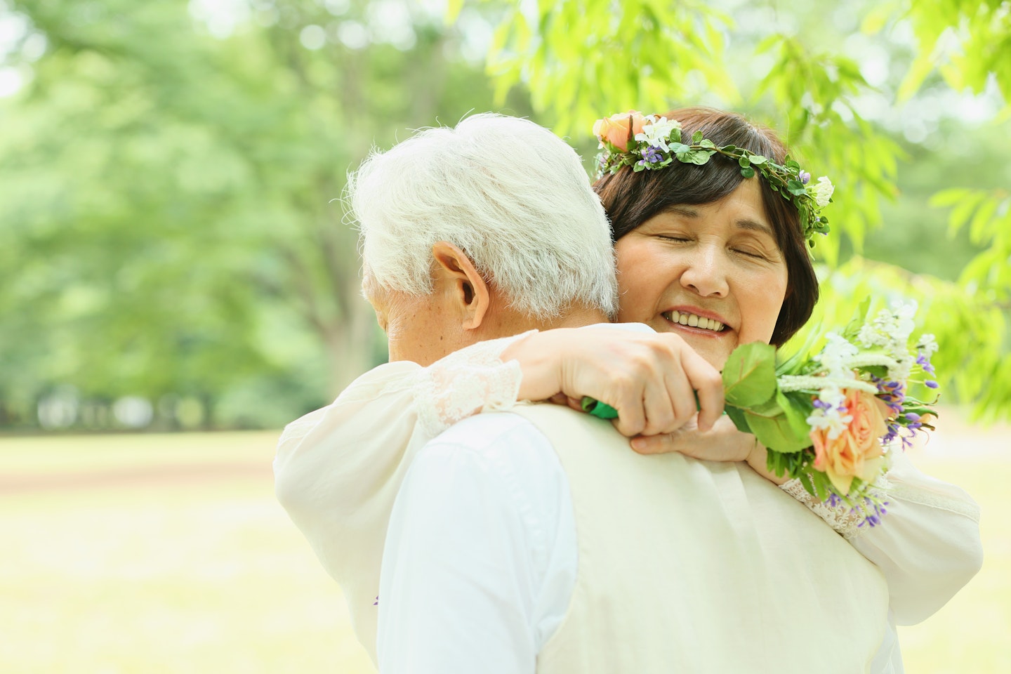 Senior married couple hugging in park