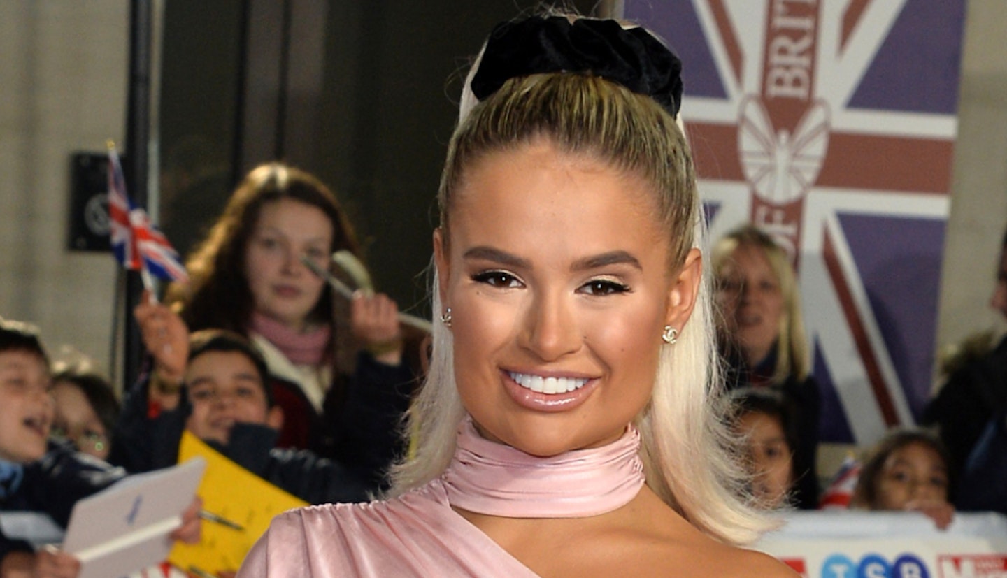 Love Island's Molly Mae shows off her curves in a plunging top as