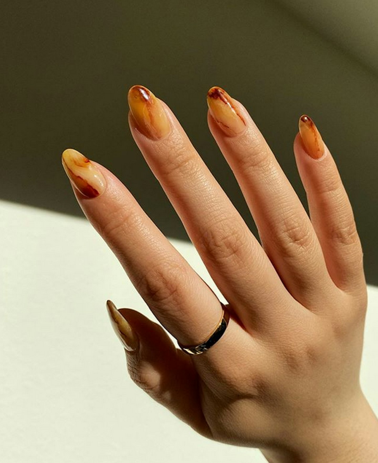 brown nail polish manicure