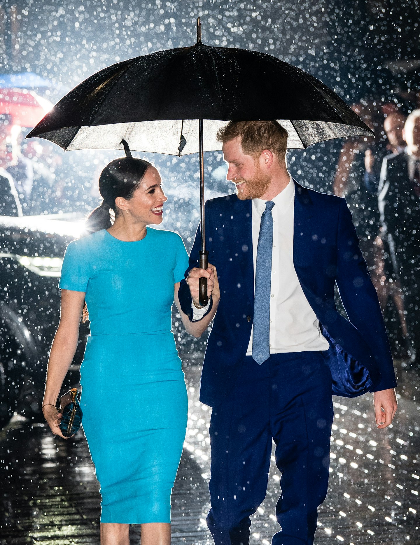 Harry and Meghan in the rain at the Endeavour Awards