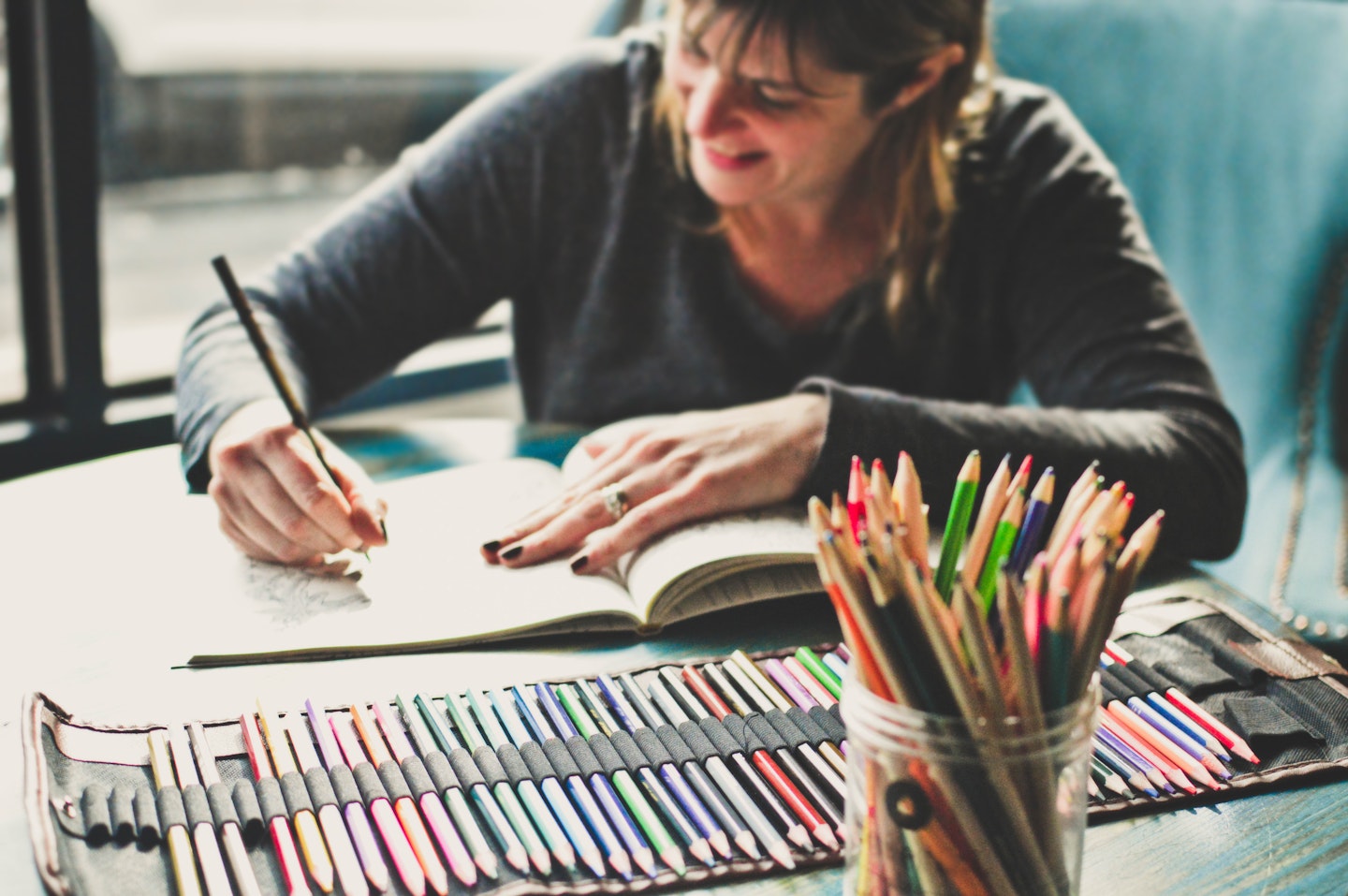 mature woman colouring pencils