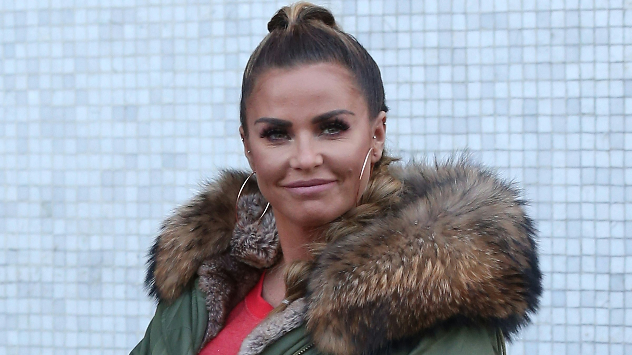 Katie Price shows off huge new boobs with long blonde hair after