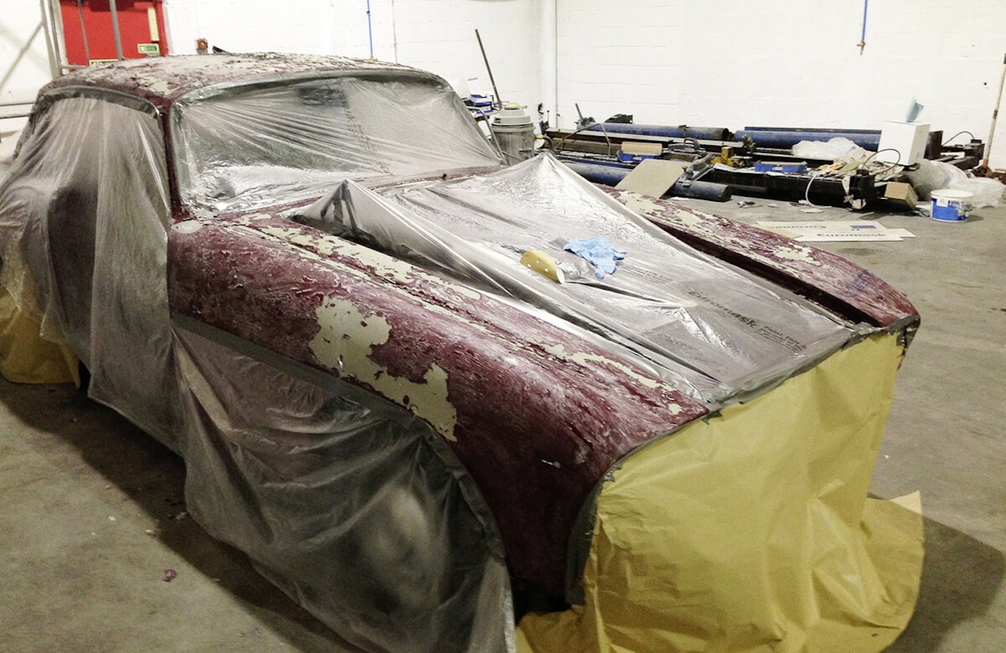 Initial paint removal was done with chemical stripper followed by oscillating pneumatic DA