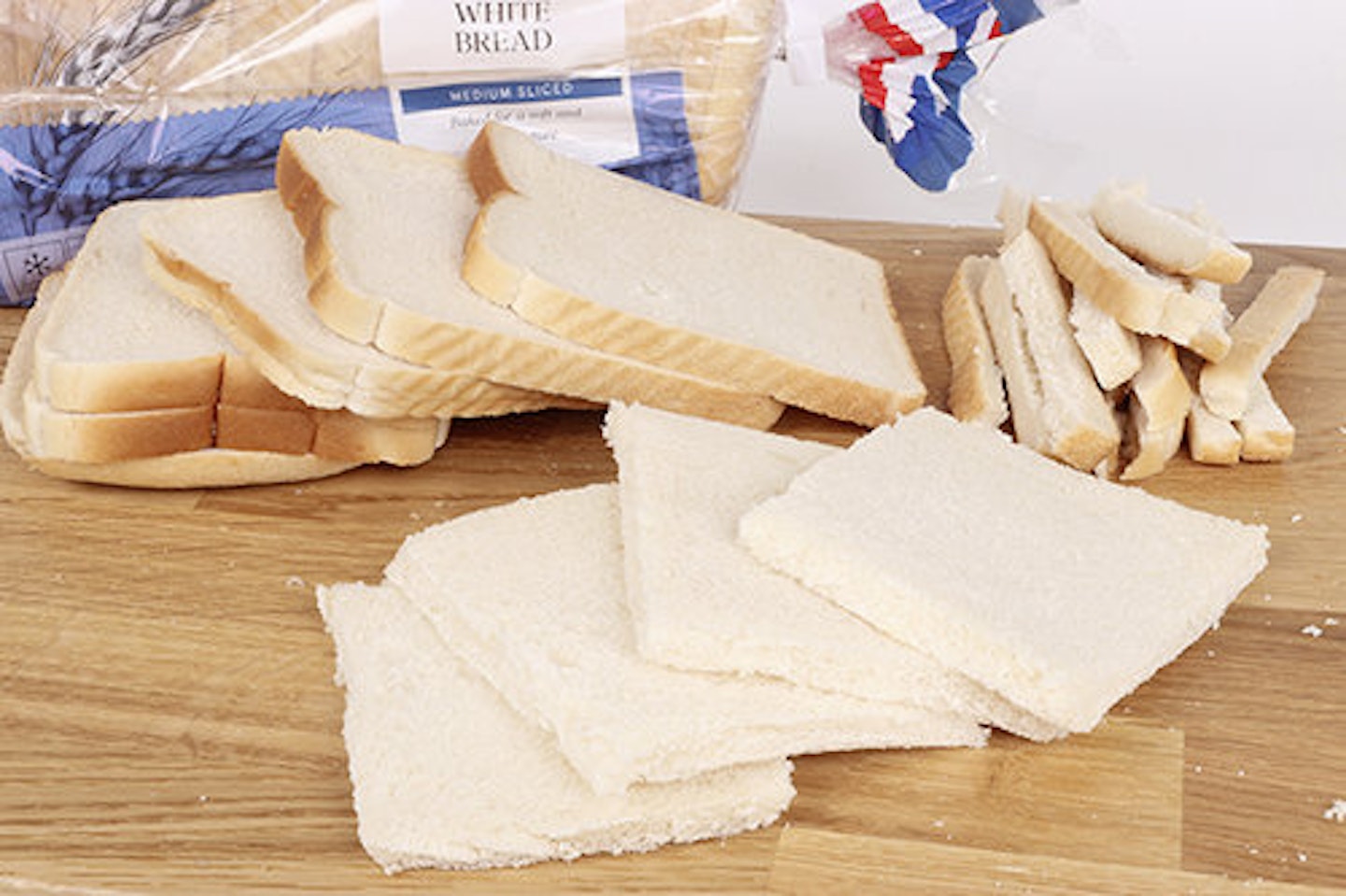 1) Remove the crusts from a few slices of medium-cut white bread.   