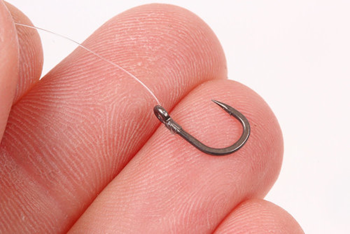 5. Tie a size 10 hook on to the hooklength using a spade-end knot that has first been passed through the eye. This is a very strong knot, ideal for hook with large eyes 