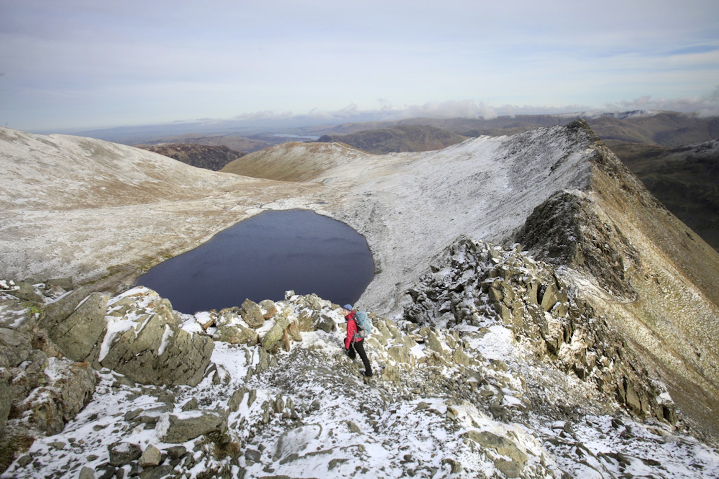 Red Tarn, beneath Striding Edge on Helvellyn.  Photo : Tom Bailey © Trail Magazine 