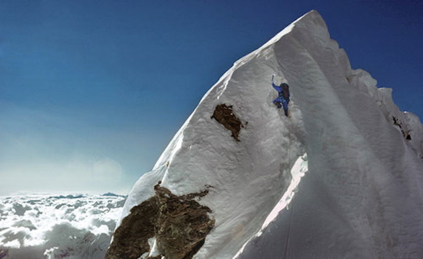 Dougal Haston on the Hillary Step during the first British ascent of Everest, 24 September 1975 – a massive contrast to 2019. Photo © Doug Scott 