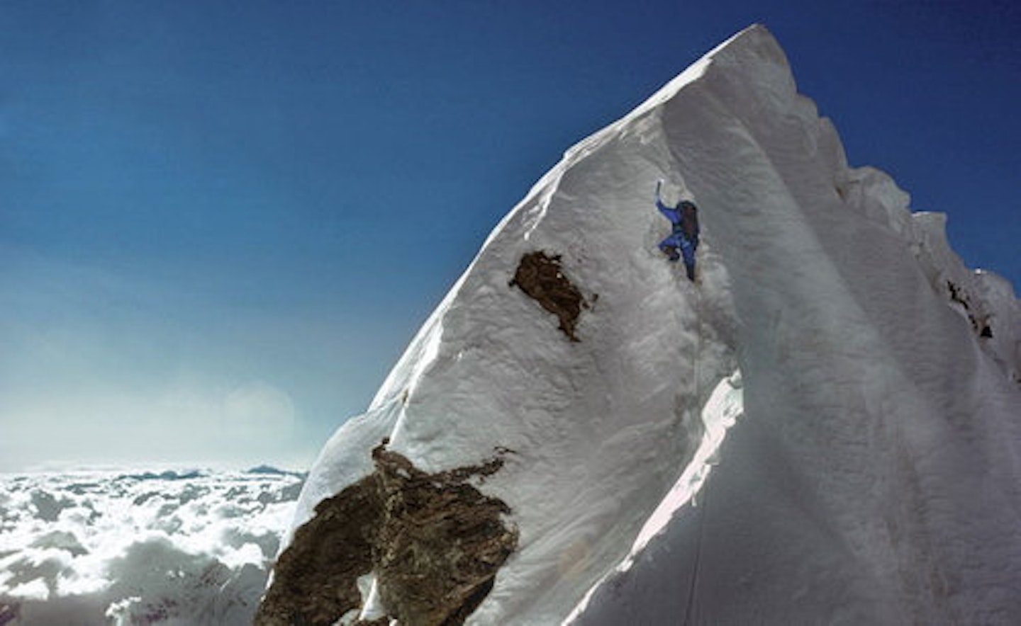 Dougal Haston on the Hillary Step during the first British ascent of Everest, 24 September 1975 – a massive contrast to 2019. Photo © Doug Scott