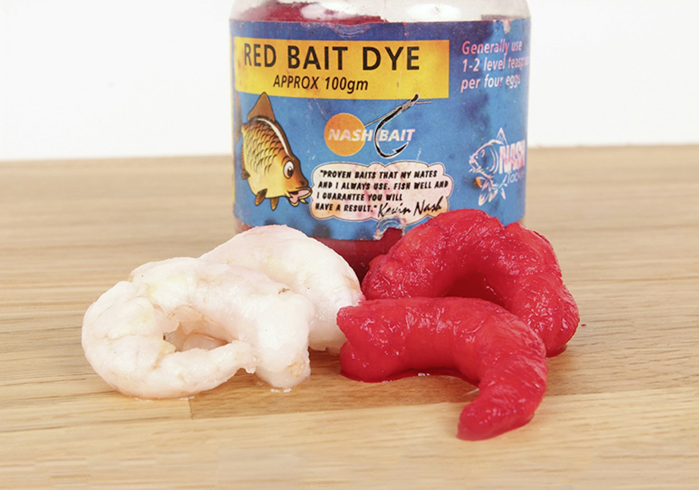 Leave prawns in water to which bright red bait dye has been added. 