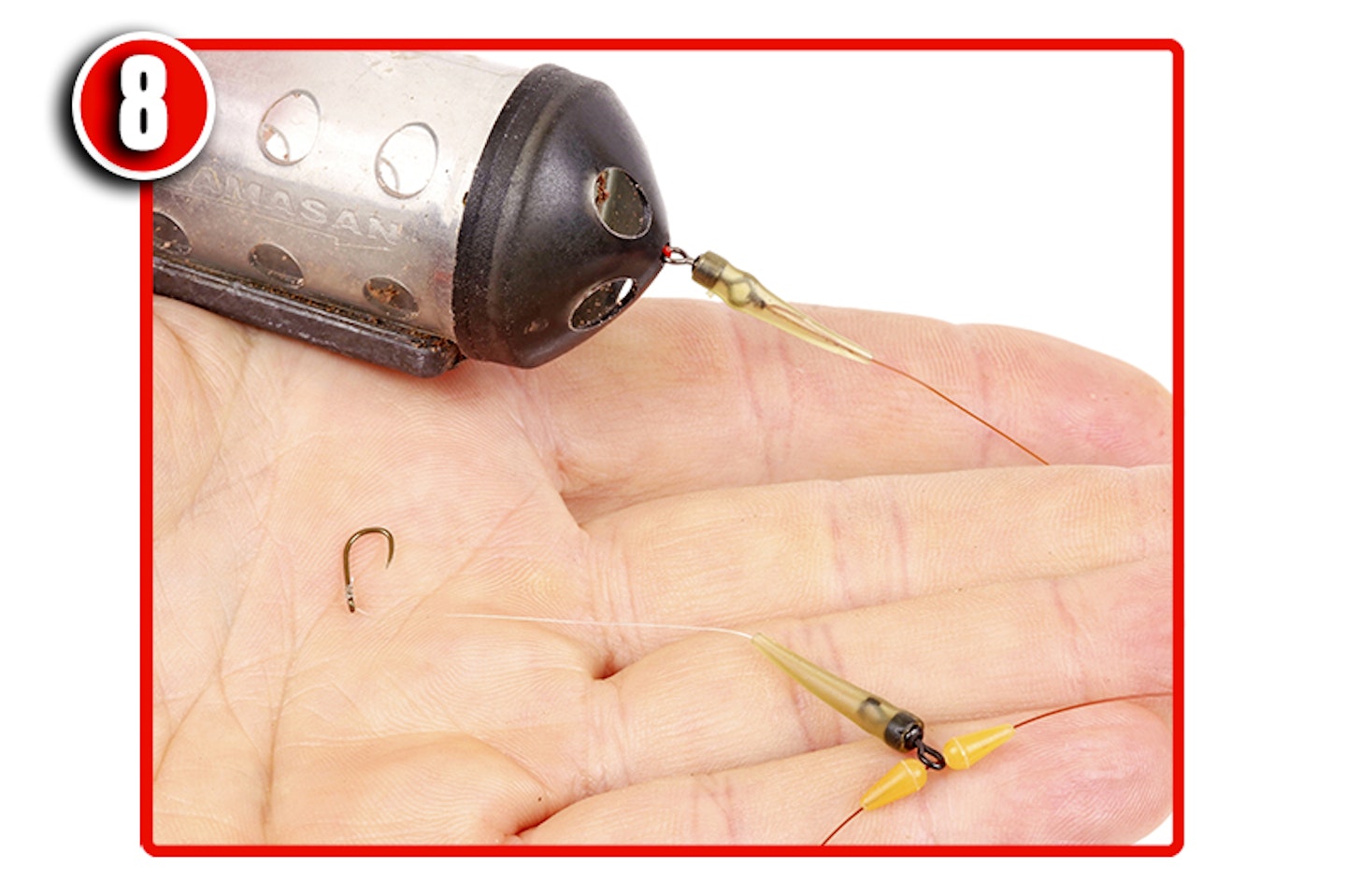 Slide the stops and hooklength into position so that the hook rests just above the feeder