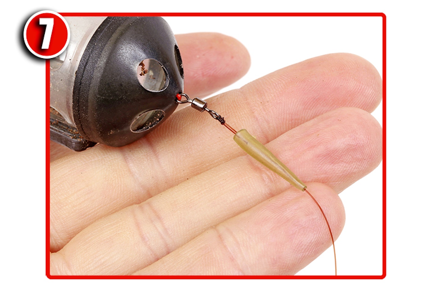 Thread another Rig Sleeve on to the mainline. Tie on swimfeeder using a four-turn grinner
