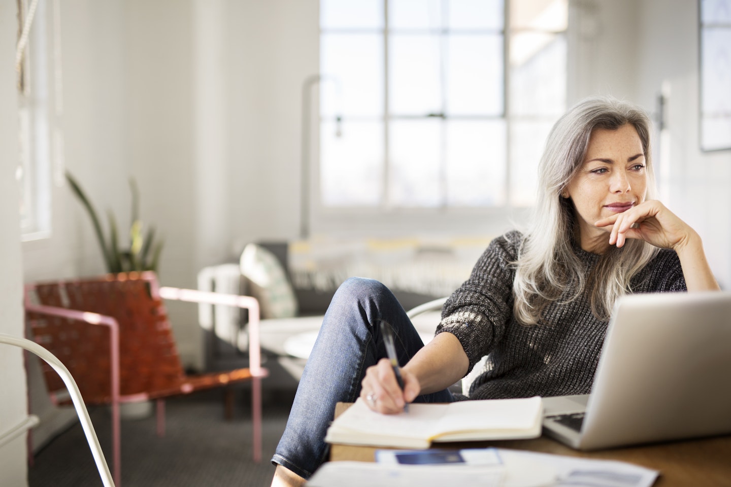 woman writing at laptop