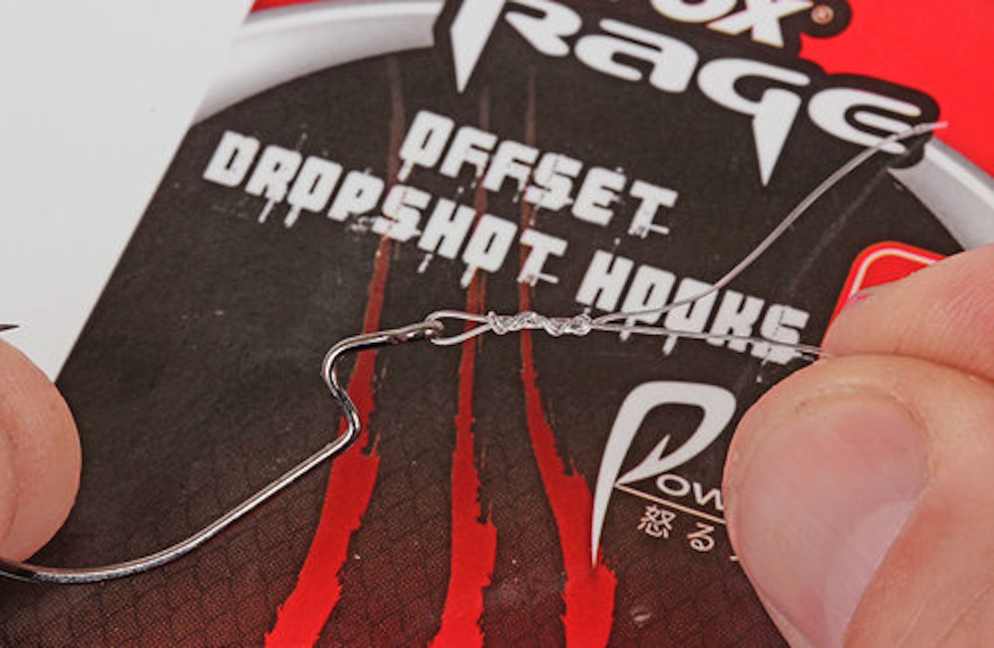 2. Tie on the offset hook using a four-turn grinner knot. With fluorocarbon, only one pass through the eye of the hook is required 