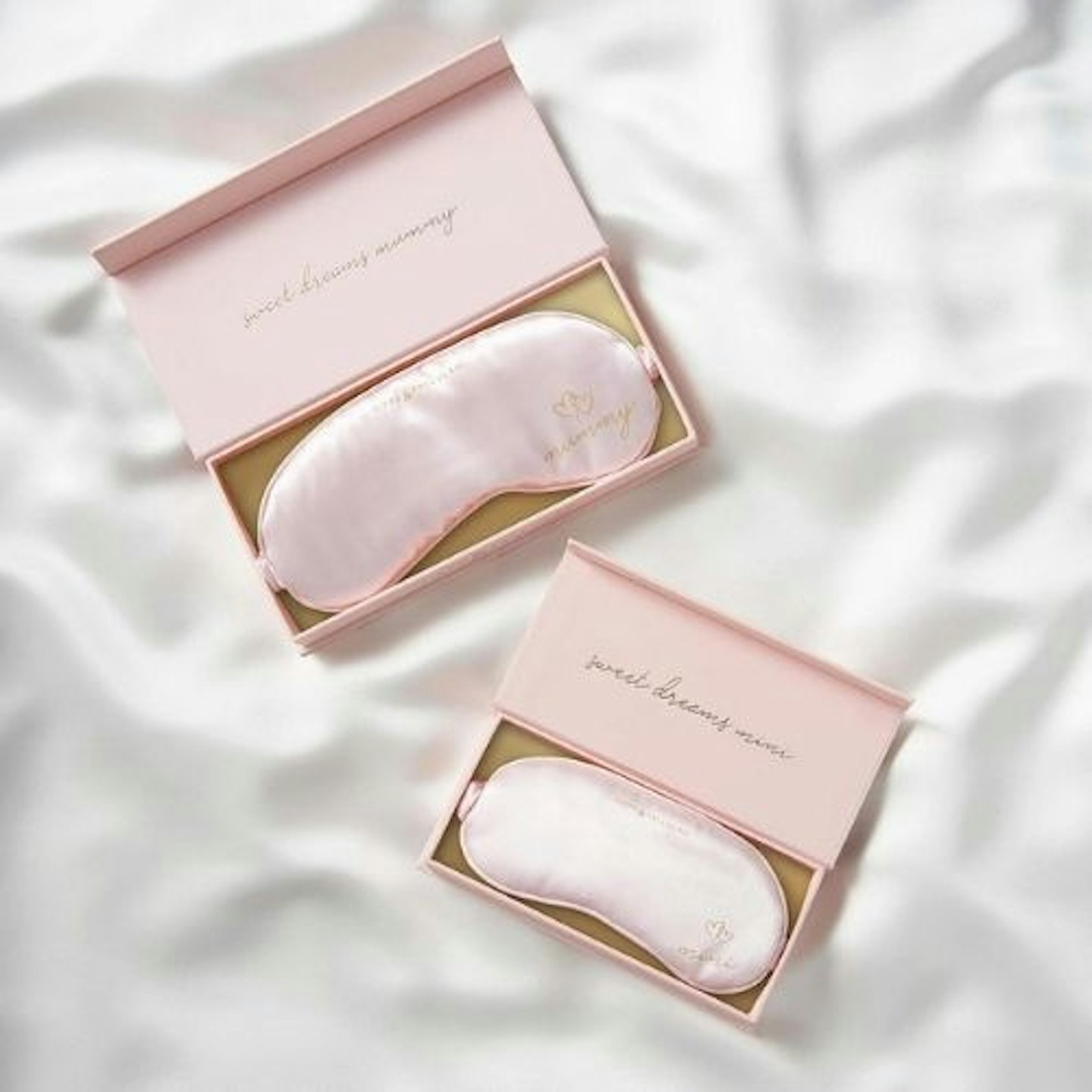 two pink sleep masks