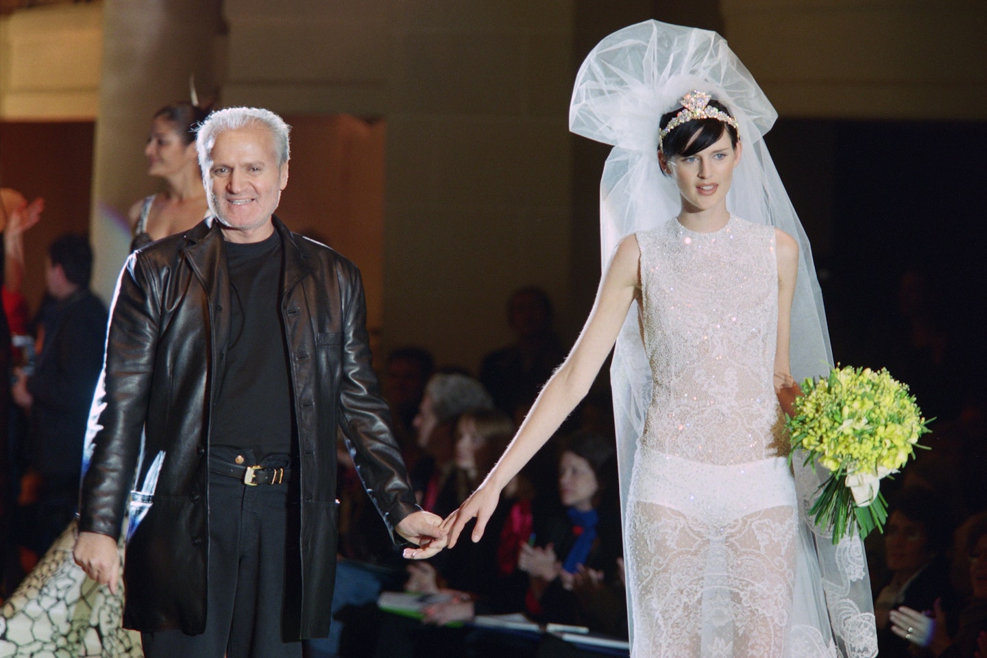 Gianni Versace with Stella Tennant on the catwalk in 1996
