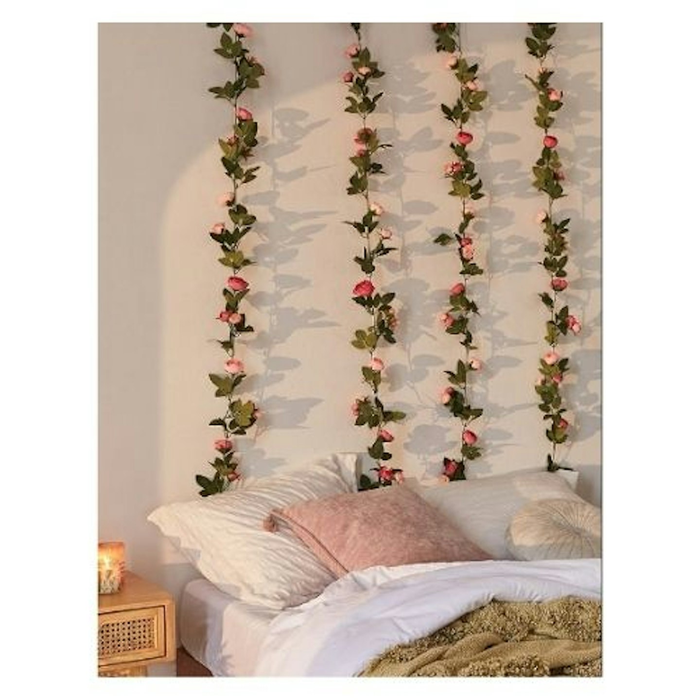 Decorative Pink Rose Vine Garland on a bedroom wall