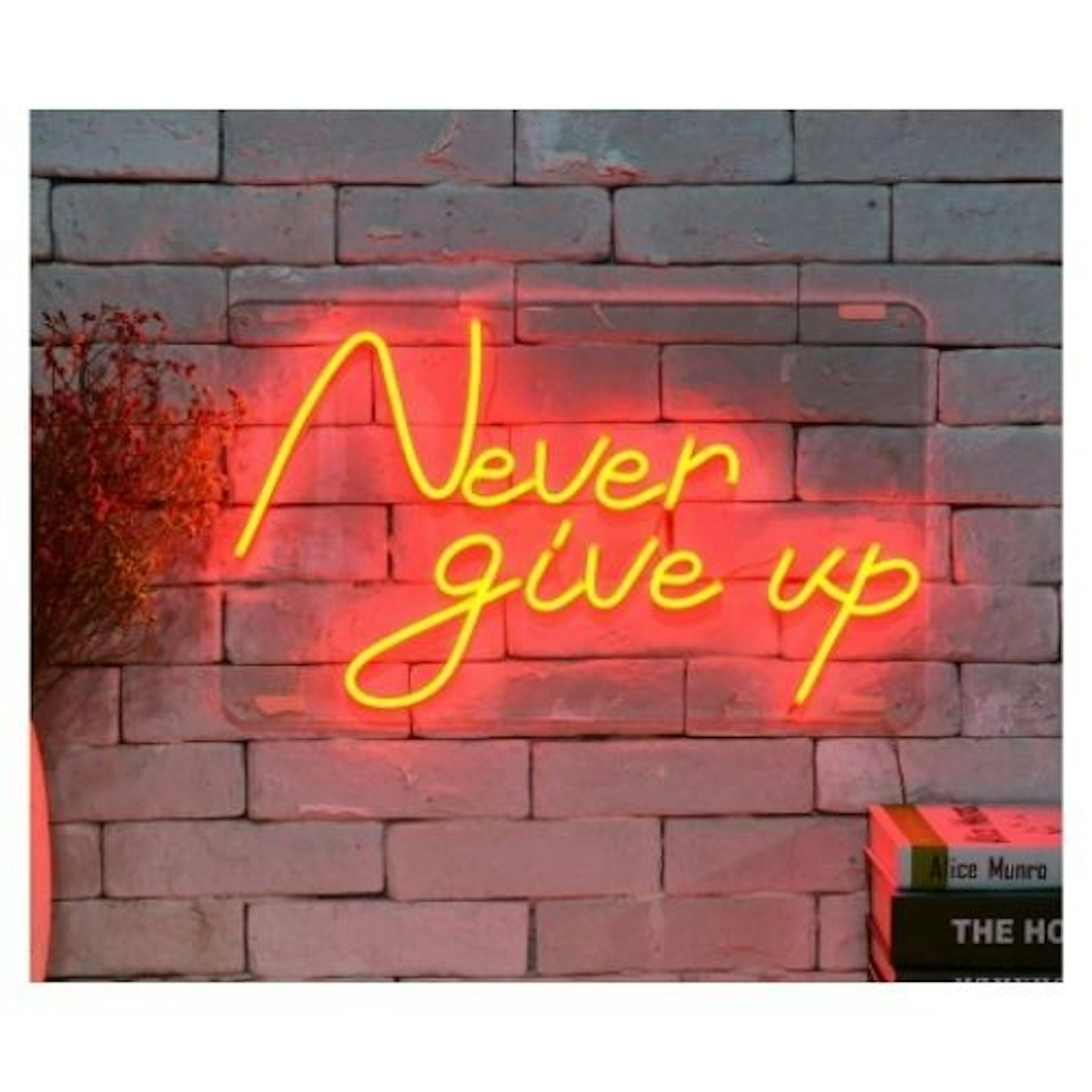 u2018Never Give Up LED Neon Wall Art on brick wall
