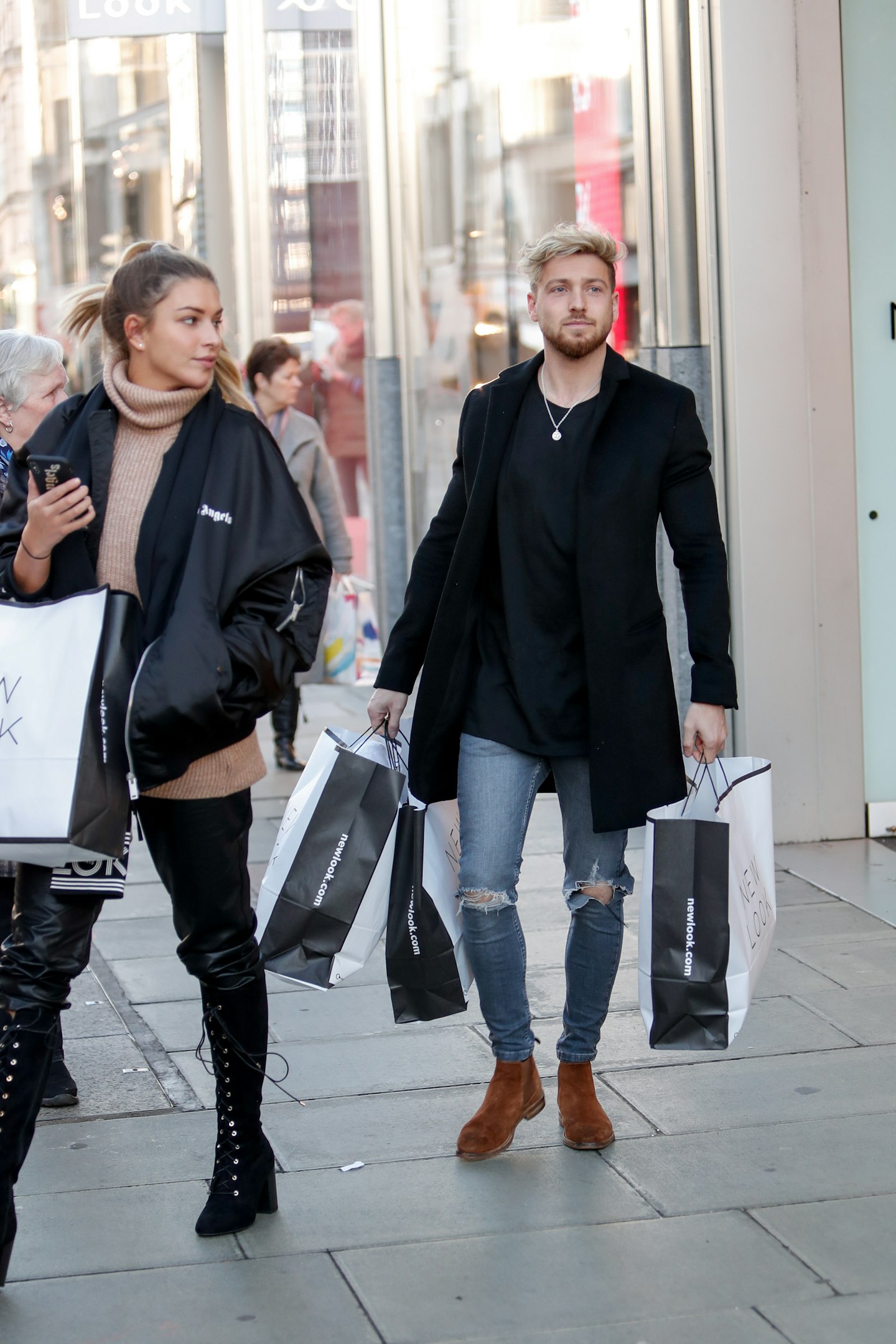 Zara McDermott and Sam Thompson shopping in New Look Oxford Street, 4 December 2019