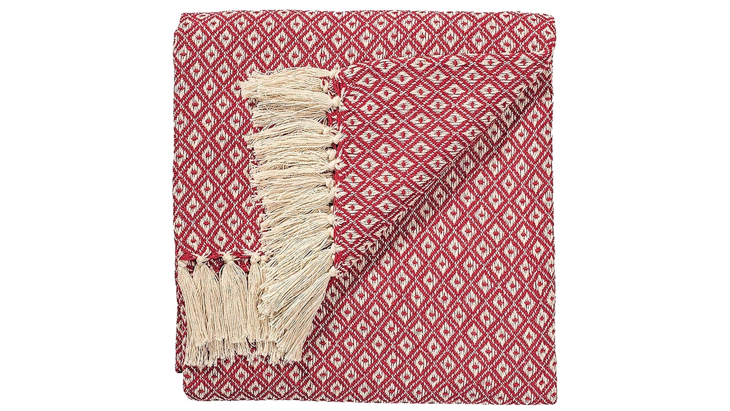 red blanket with natural tassels