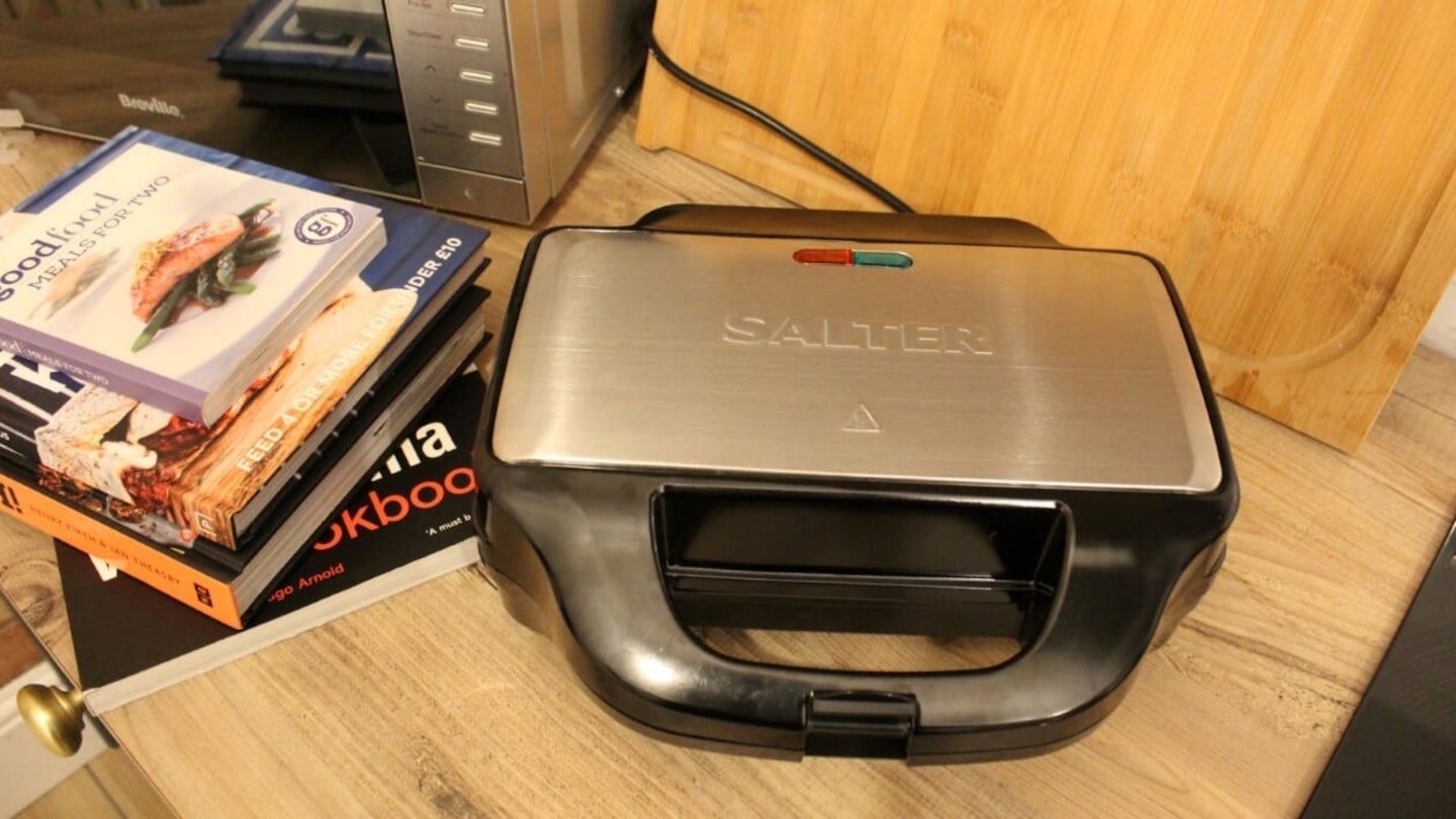 Salter 4-in-1 snack maker in kitchen set up next to cooking books