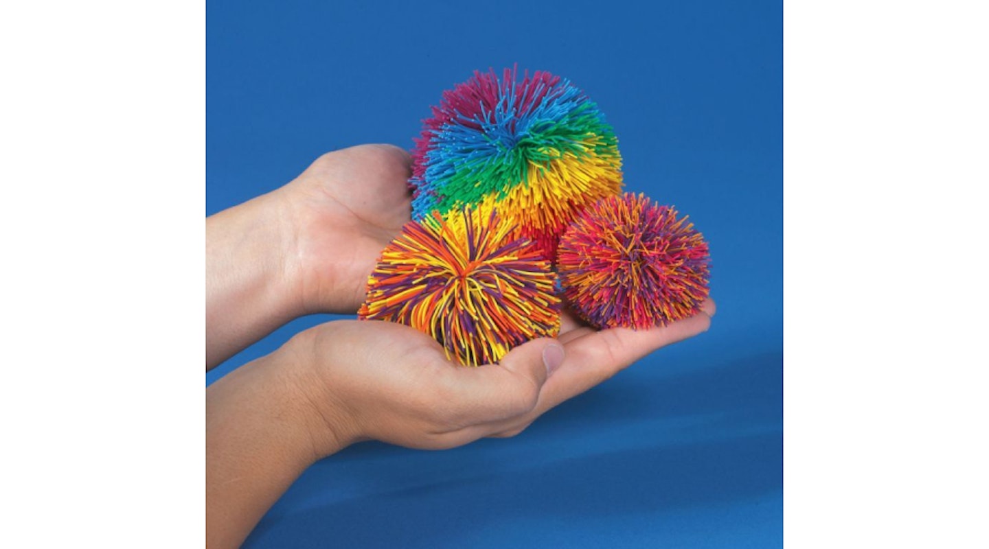 colourful Koosh balls in hand