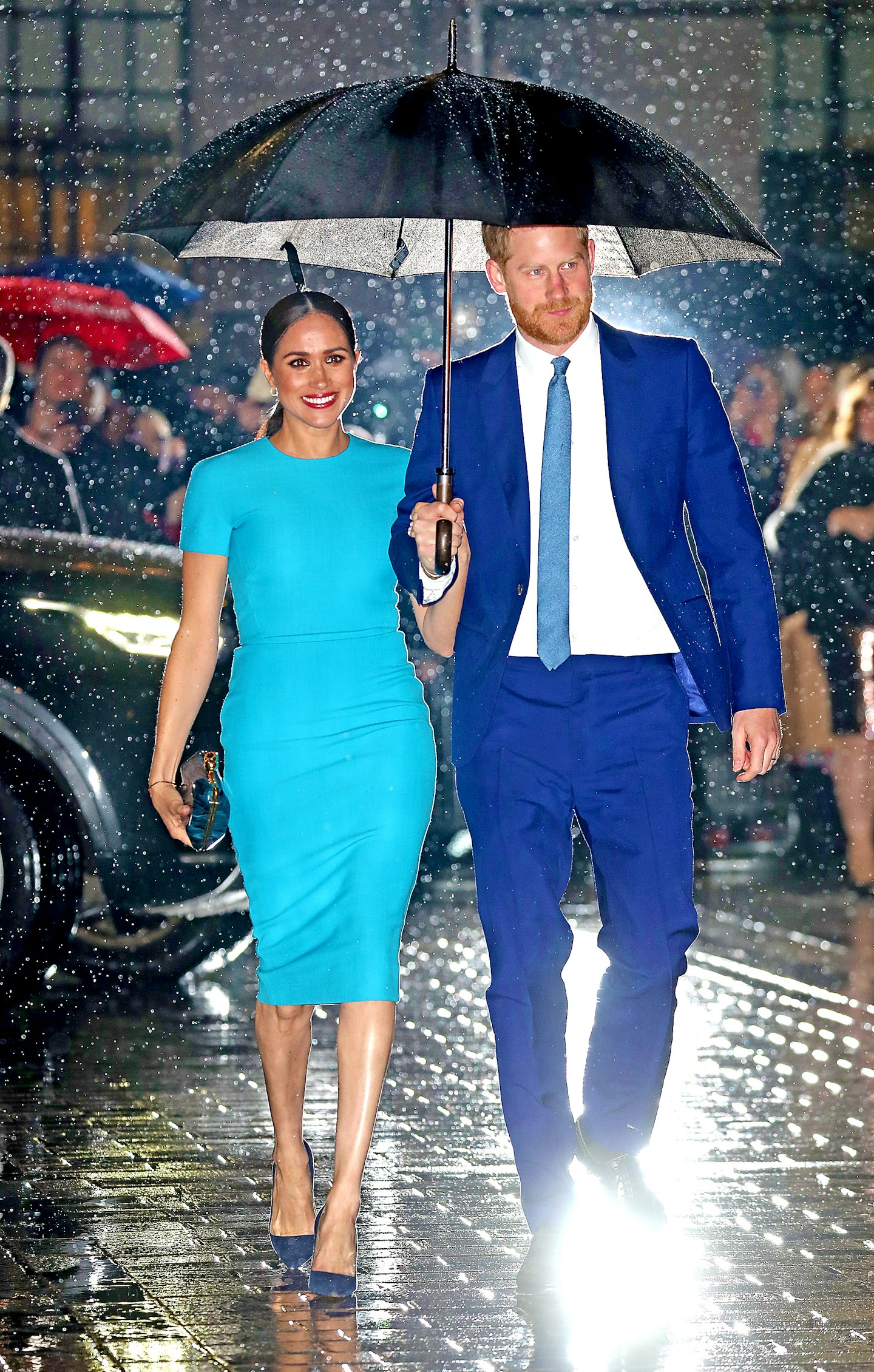 Meghan Markle and Prince Harry spotted out in rain