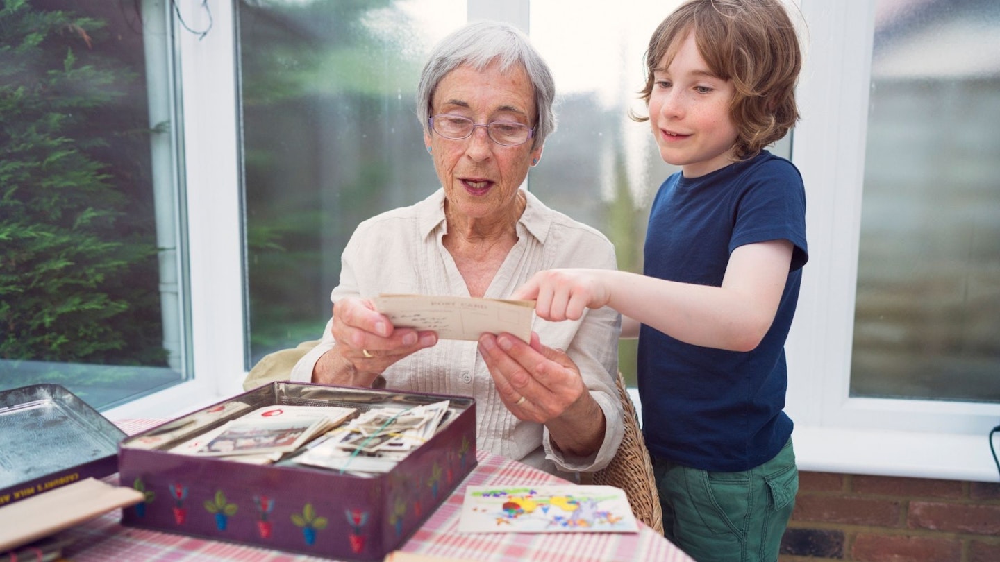 Memory Box: Grandmother and grandson looking through old photographs