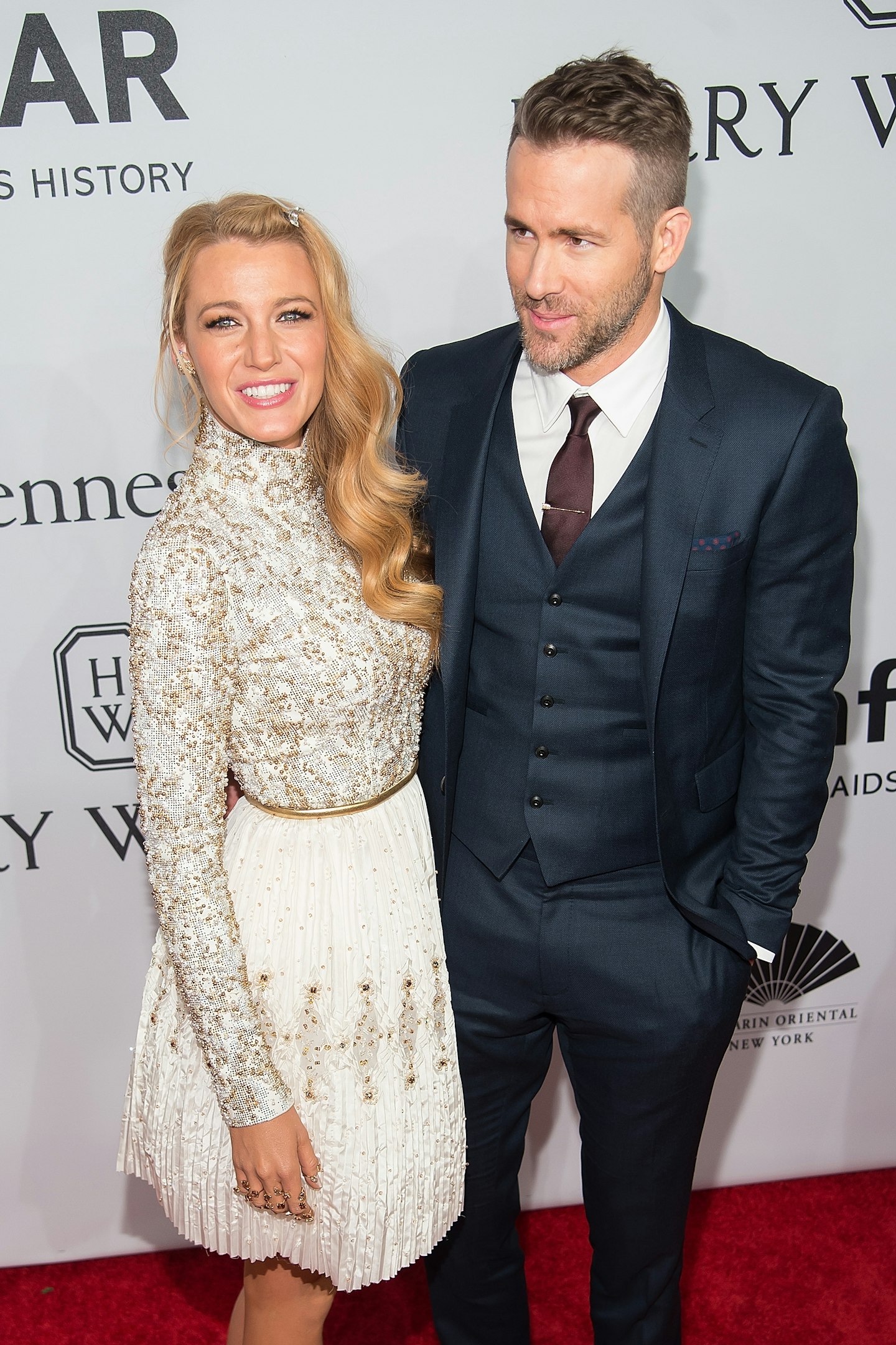 Blake Lively (L) and Ryan Reynolds attend the 2016 amfAR New York Gala at Cipriani Wall Street on February 10, 2016 in New York City