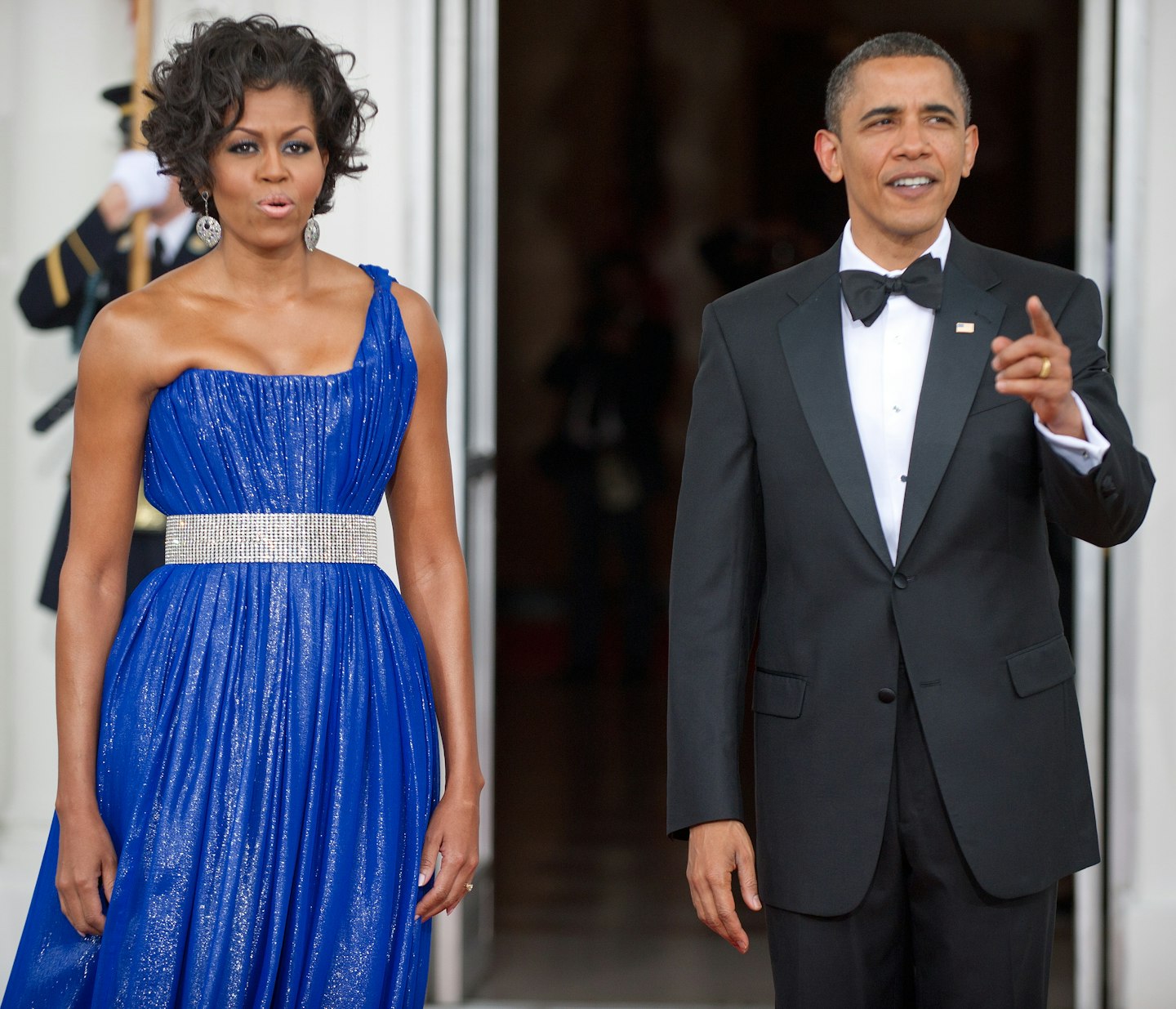 US First Lady Michelle Obama and US President Barack Obama wait on the red carpet for the arrival of the Mexican President and his wife May 19, 2010 on the North Portico at the State Dinner for Mexico at the White House in Washington, DC