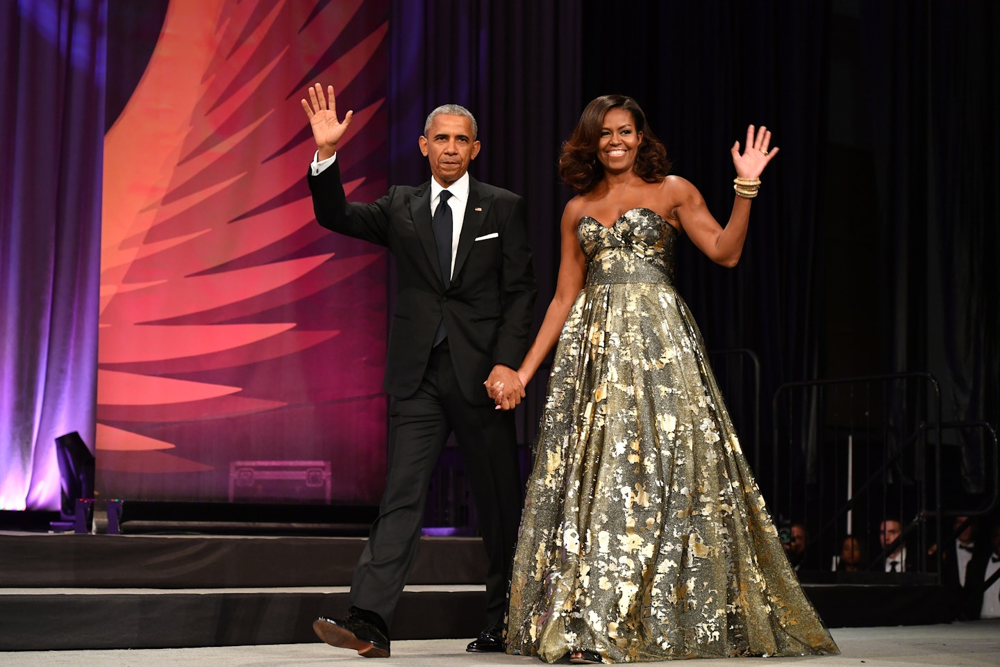 US President Barack Obama and First Lady Michelle Obama arrive on stage during the Congressional Black Caucus Foundation's Phoenix Awards Dinner on September 17, 2016 in Washington.