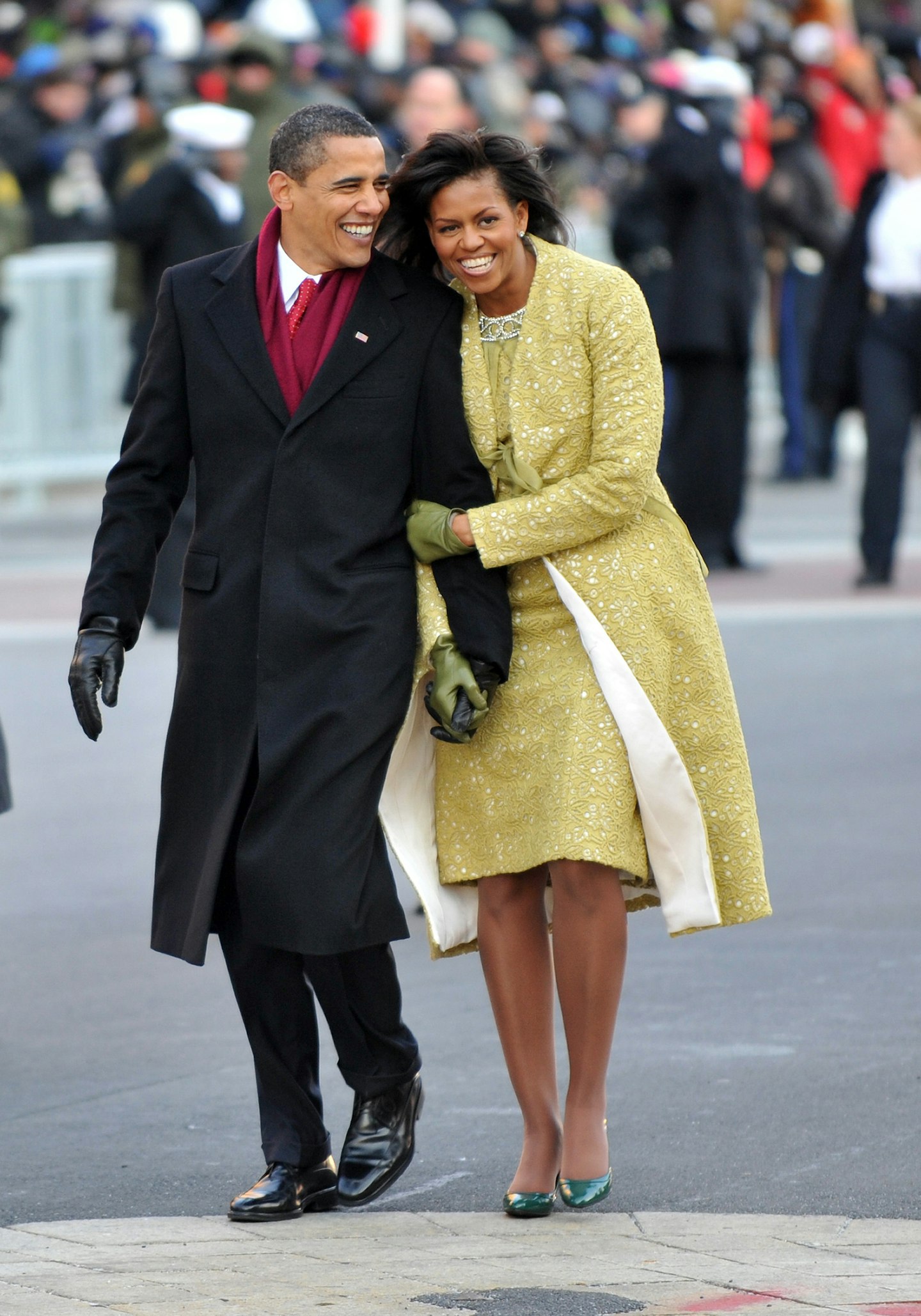 President Barack Obama and first lady Michelle Obama walk in the Inaugural Parade on January 20, 2009 in Washington, DC.