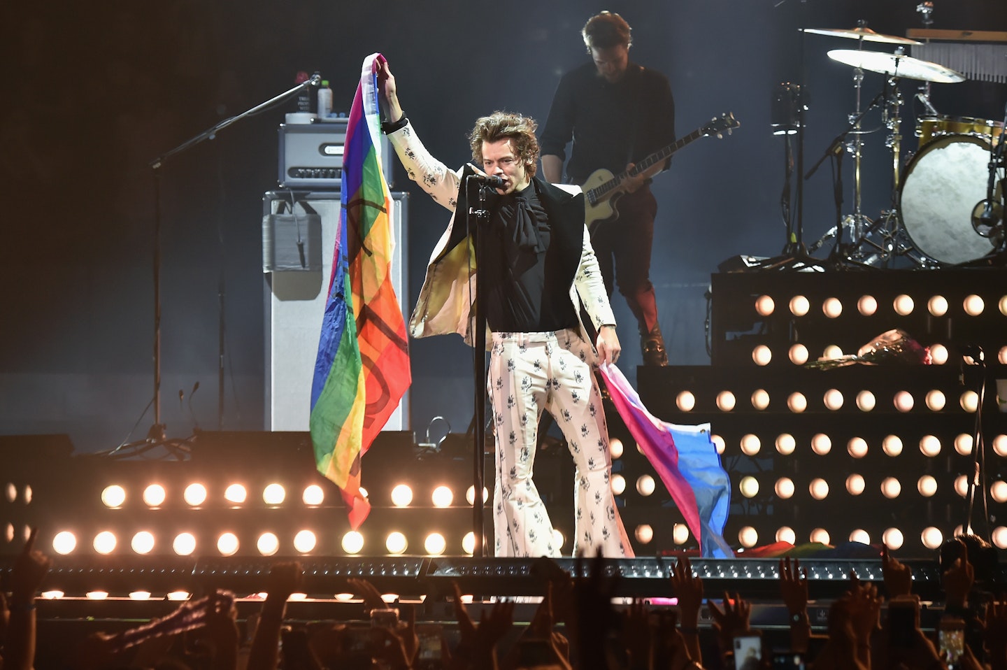 Harry Styles holds rainbow flags as he performs onstage during Harry Styles: Live On Tour - New York at Madison Square Garden on June 21, 2018 in New York City.