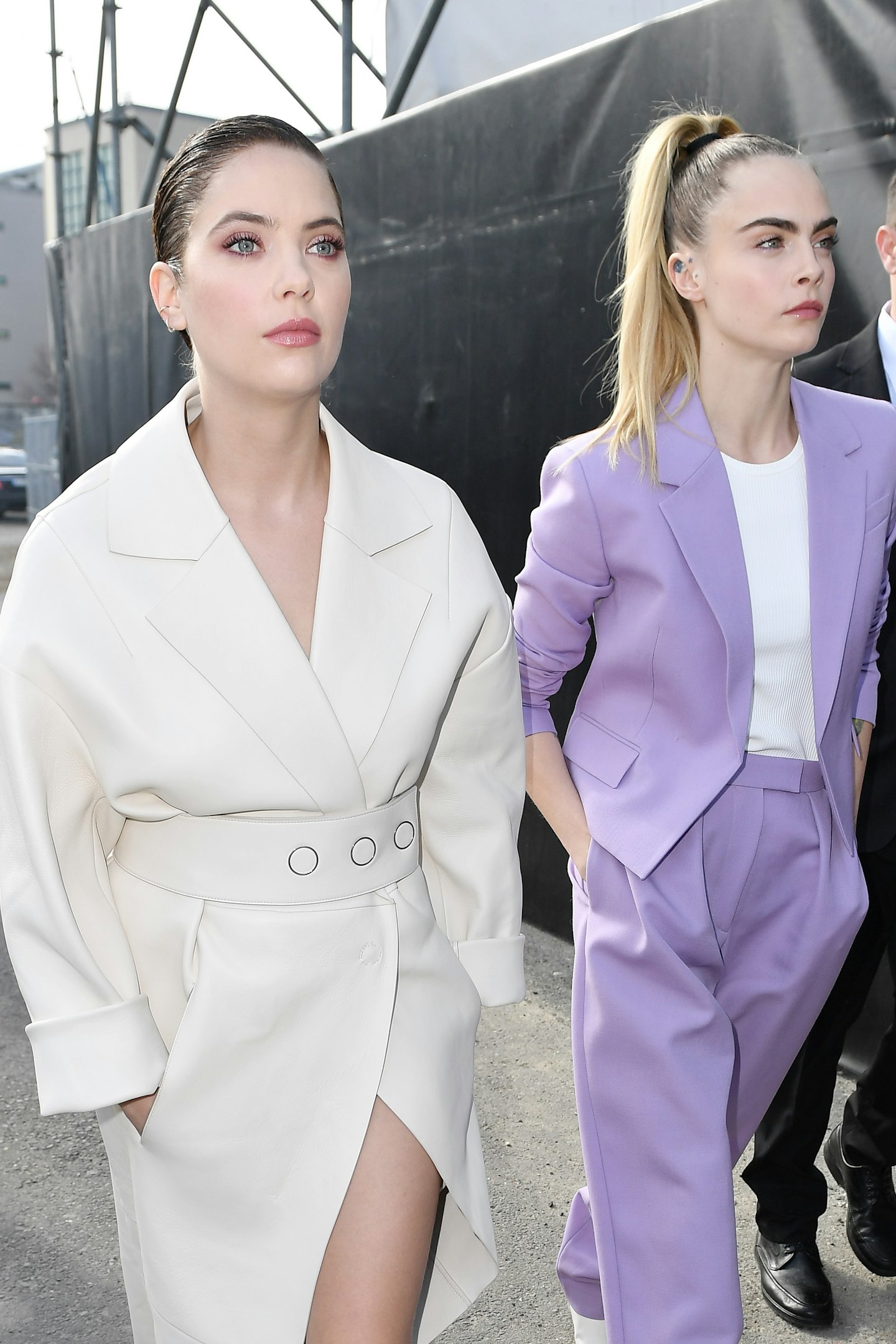 Ashley Benson and Cara Delevingne arrive at the Boss fashion show on February 23, 2020 in Milan, Italy. 