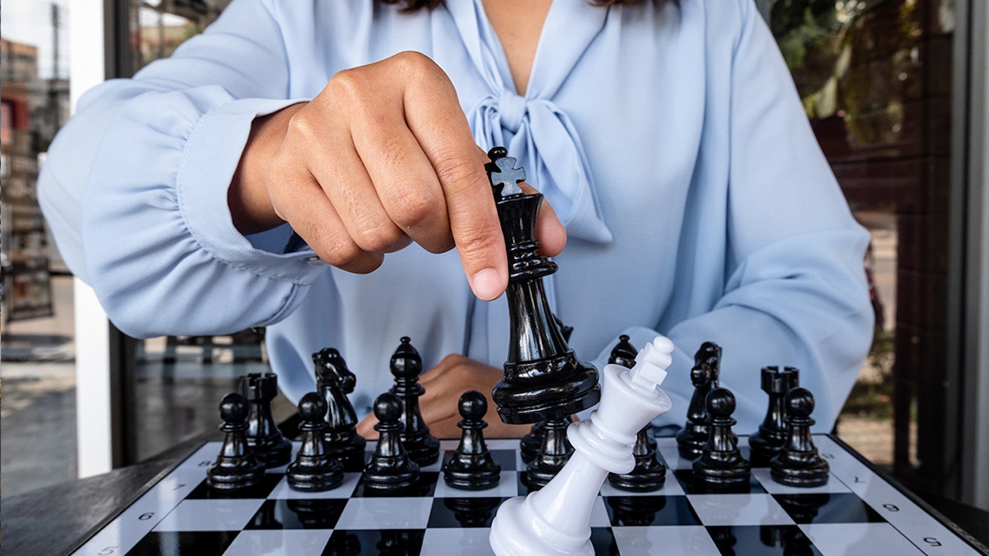 woman playing chess