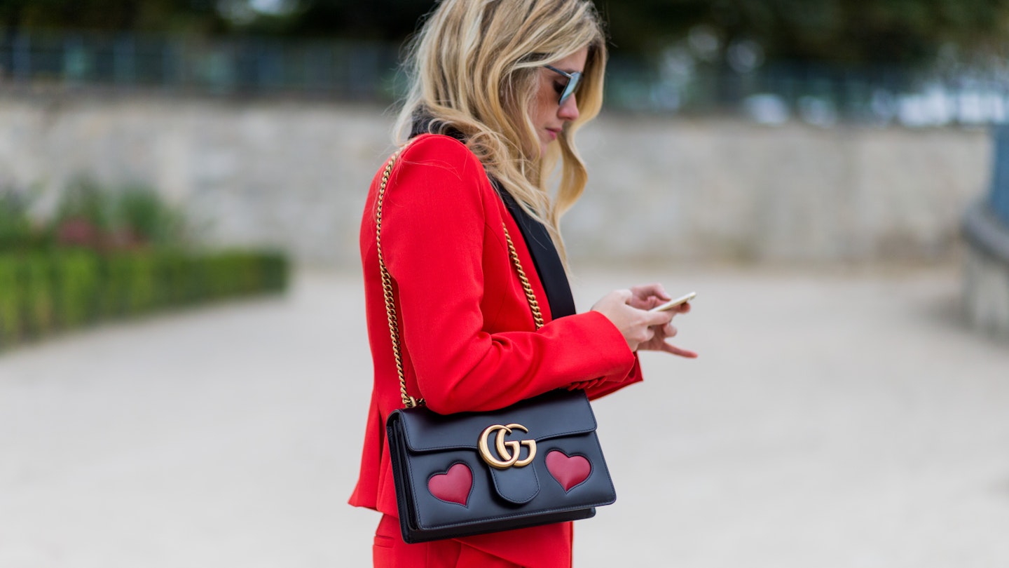 Red suit street style heart bag