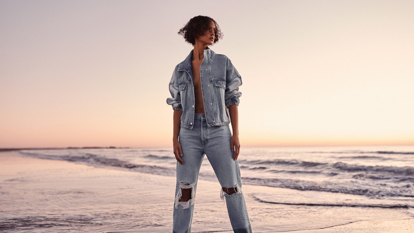 Model wearing denim jacket and jeans from Mango
