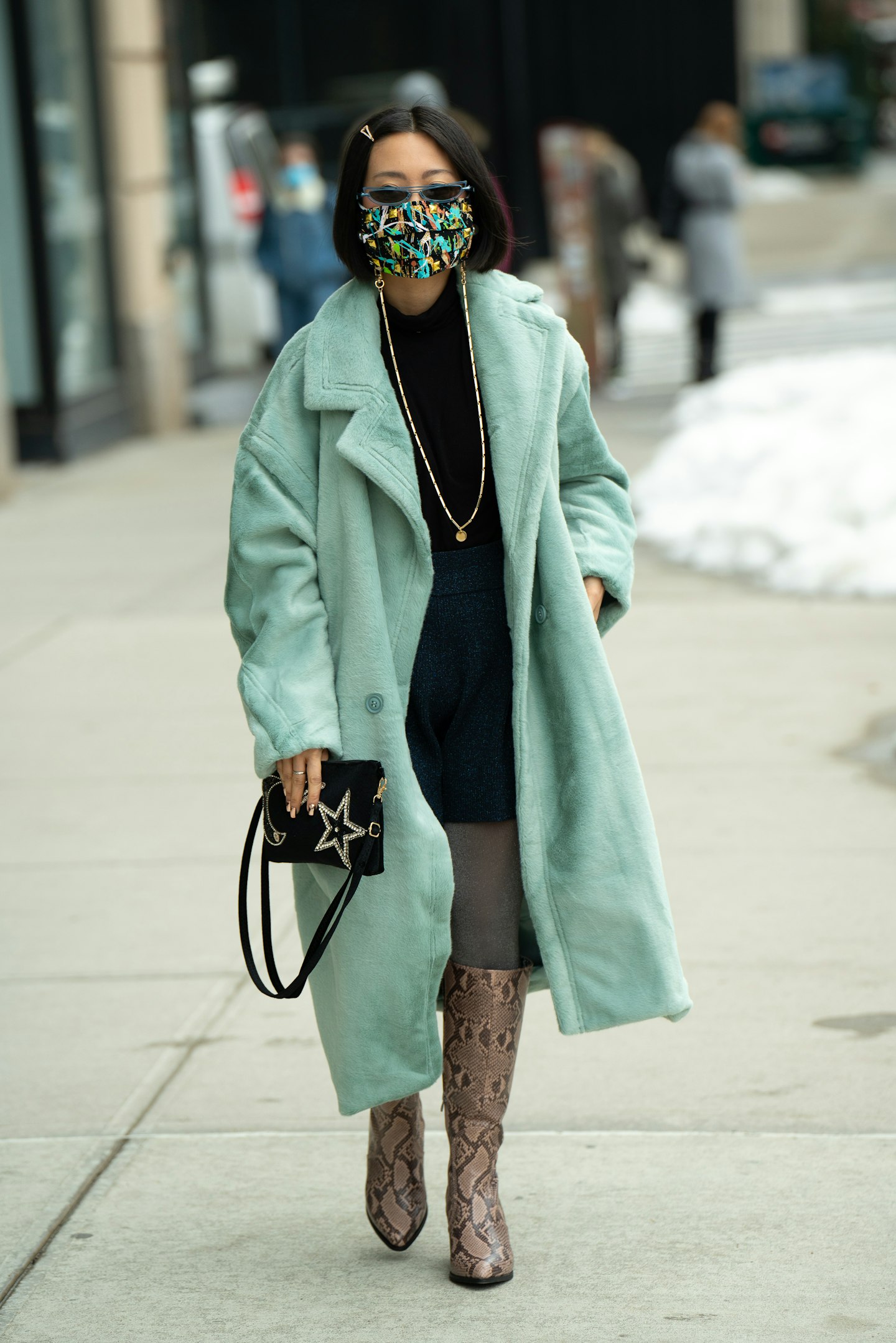 A woman wearing a blue coat at NYFW