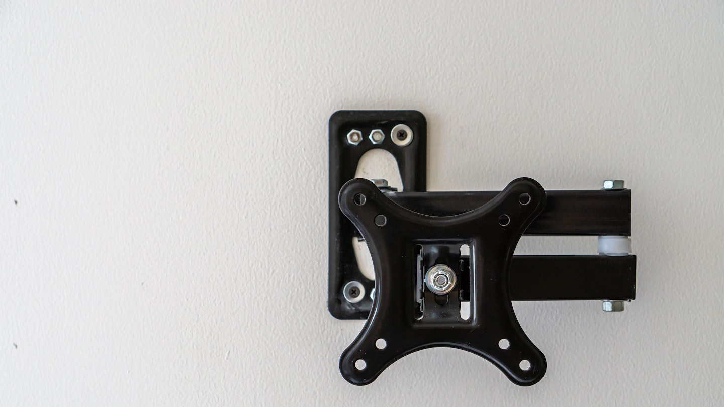 A TV wall mount attached to a wall