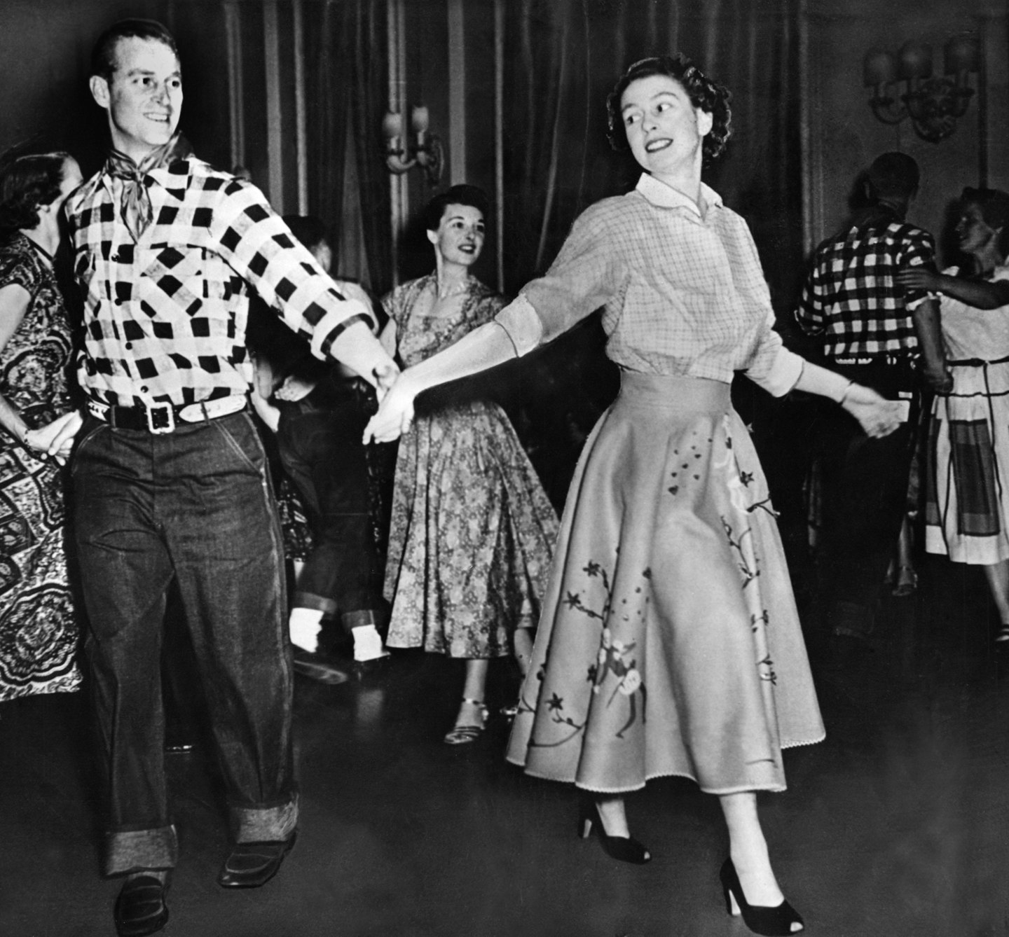 Prince Philip and the Queen line dancing