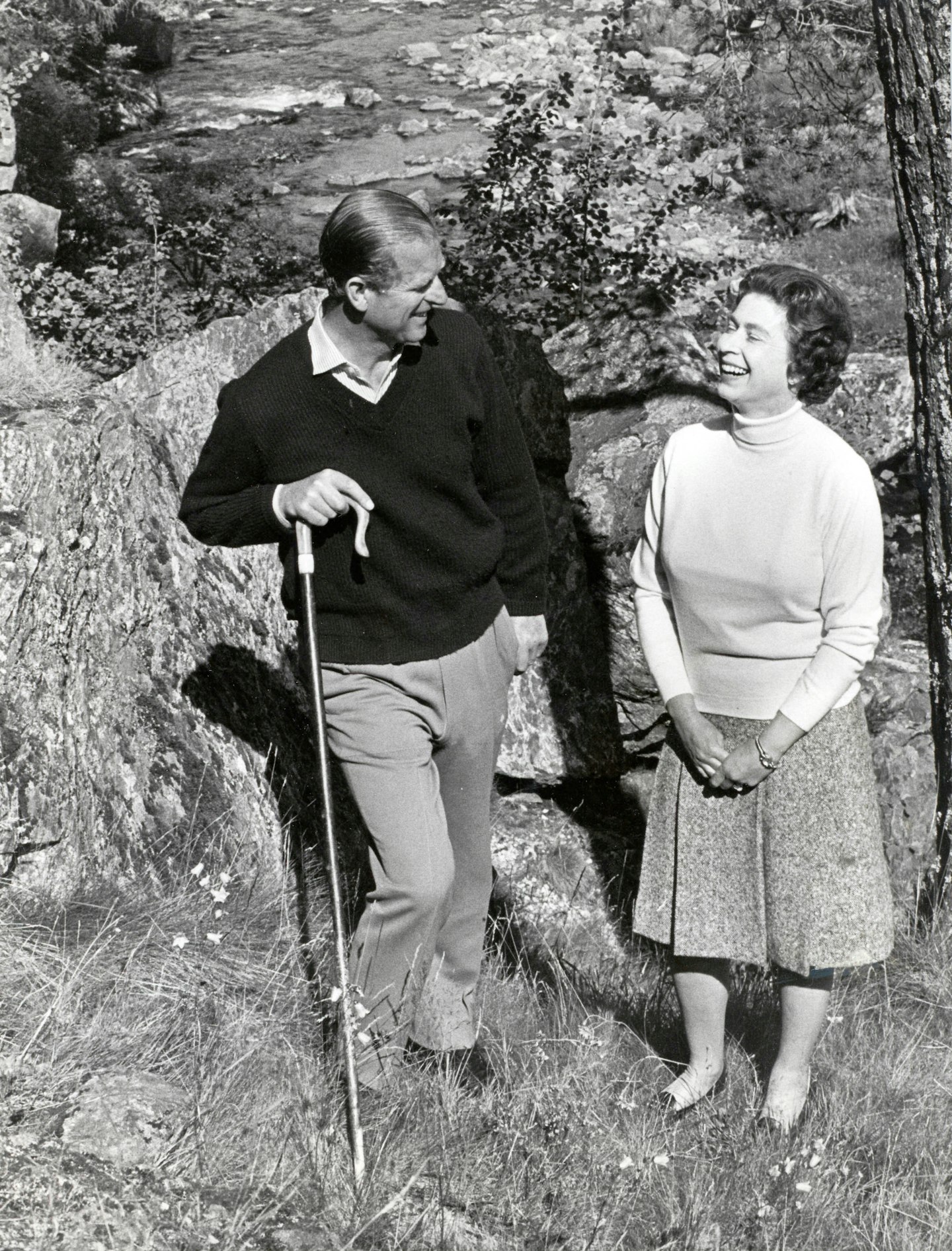 Queen Elizabeth II with her husband Prince Philip walking