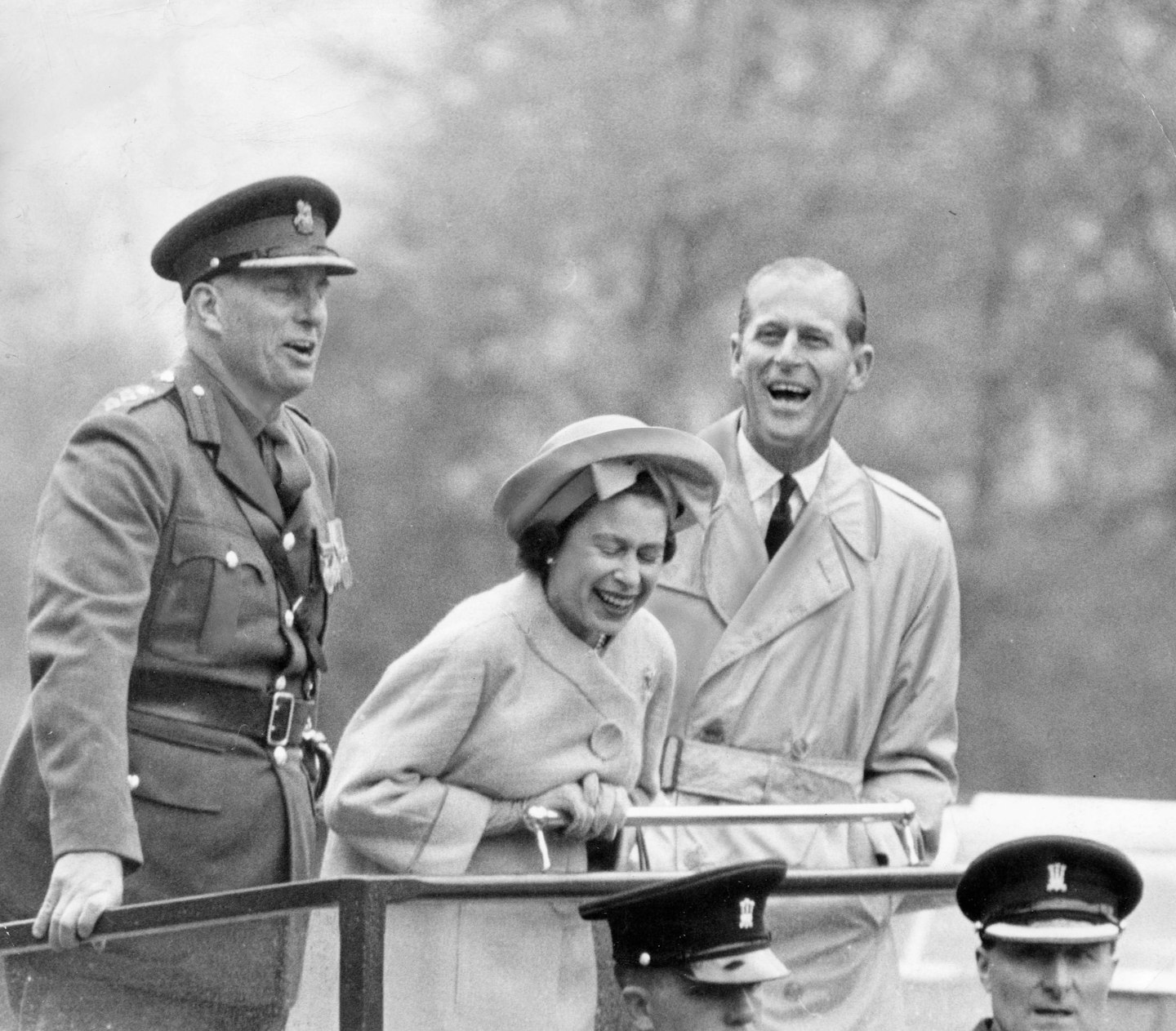 Queen Elizabeth II with her husband Prince Philip laughing